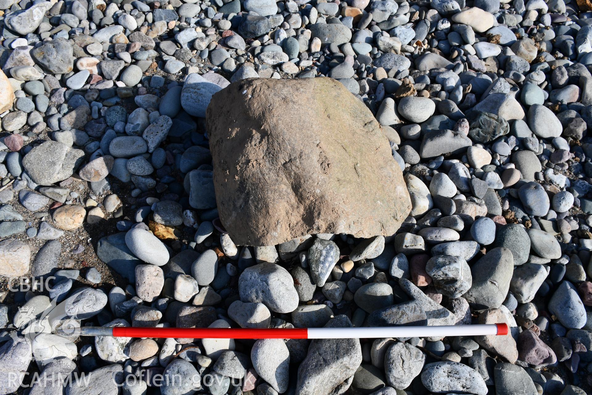 Stone on beach, 2m scale. Taken by Toby Driver. Produced with EU funds through the Ireland Wales Co-operation Programme 2014-2023. All material made freely available through the Open Government Licence.