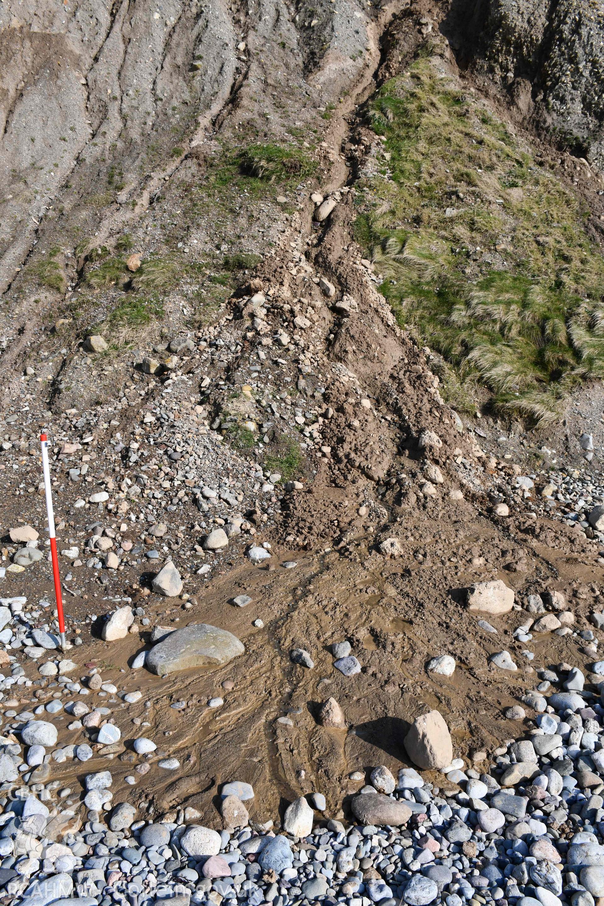 Close up of run-off of sediments onto beach, 2m scale. Taken by Toby Driver. Produced with EU funds through the Ireland Wales Co-operation Programme 2014-2023. All material made freely available through the Open Government Licence.