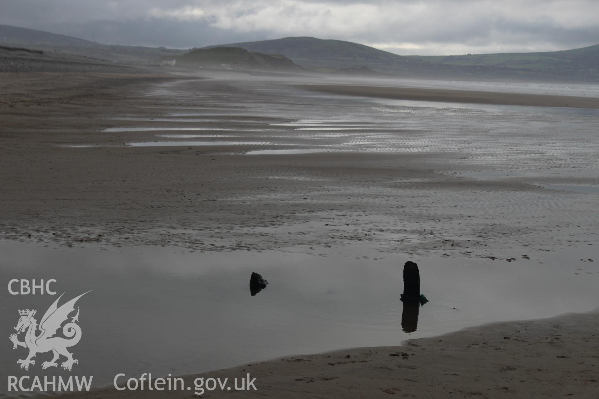 Wide shot of wreck exposed on beach Taken by Toby Driver. Produced with EU funds through the Ireland Wales Co-operation Programme 2014-2023. All material made freely available through the Open Government Licence.