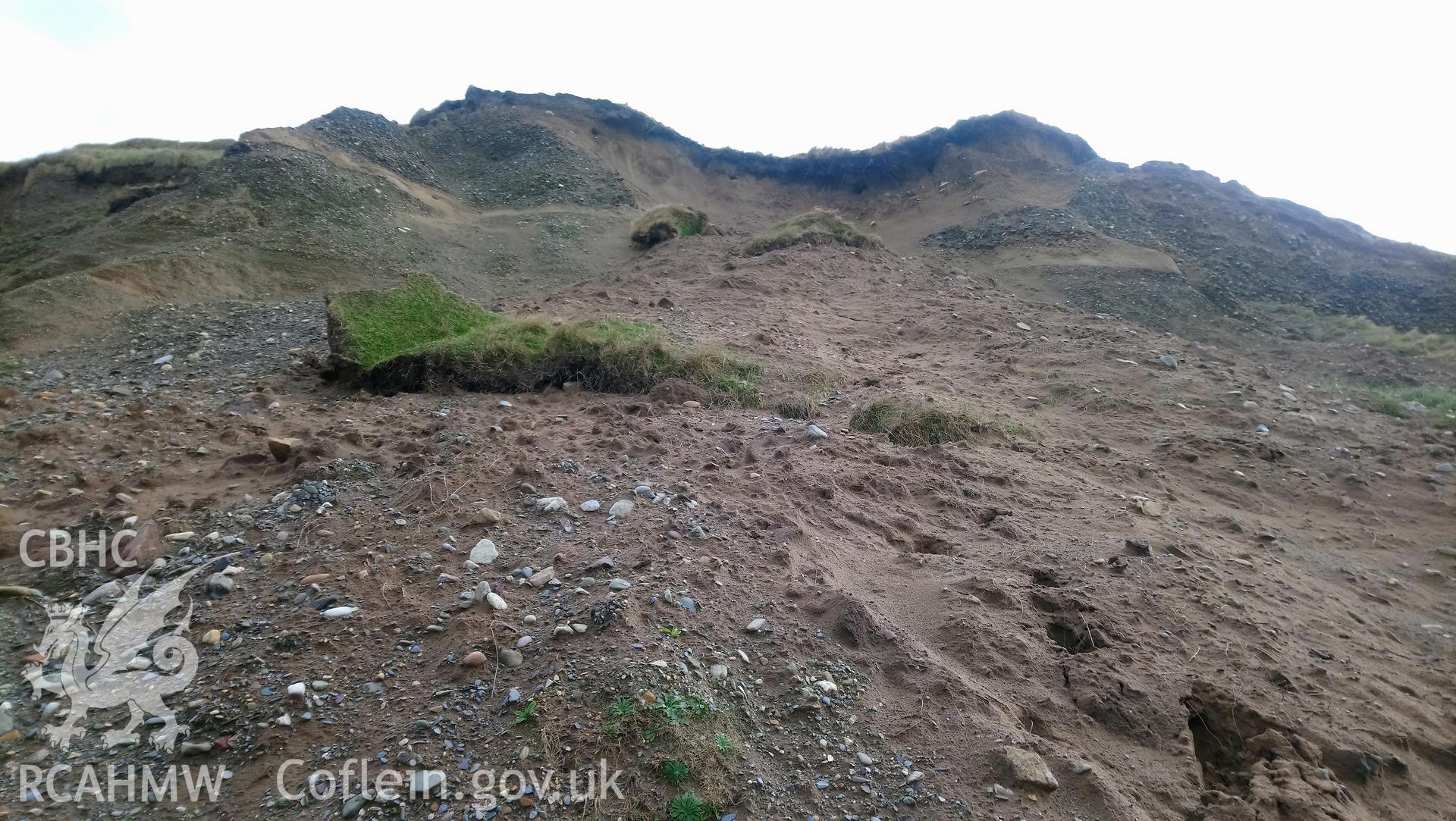 Eroding cliff face with patches of fallen turf. Taken by Toby Driver. Produced with EU funds through the Ireland Wales Co-operation Programme 2014-2023. All material made freely available through the Open Government Licence.