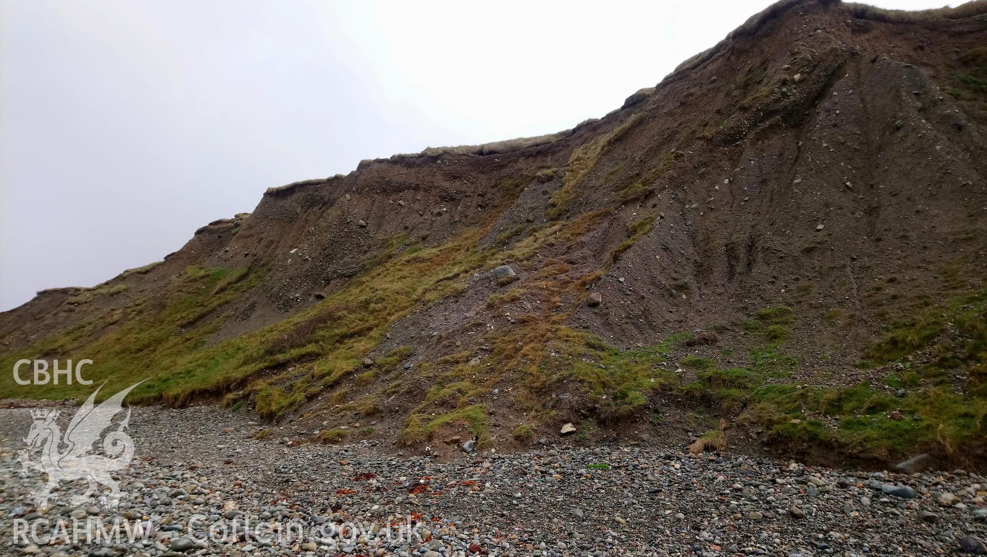 Eroding cliff face. Camera facing NE. Taken by Toby Driver. Produced with EU funds through the Ireland Wales Co-operation Programme 2014-2023. All material made freely available through the Open Government Licence.