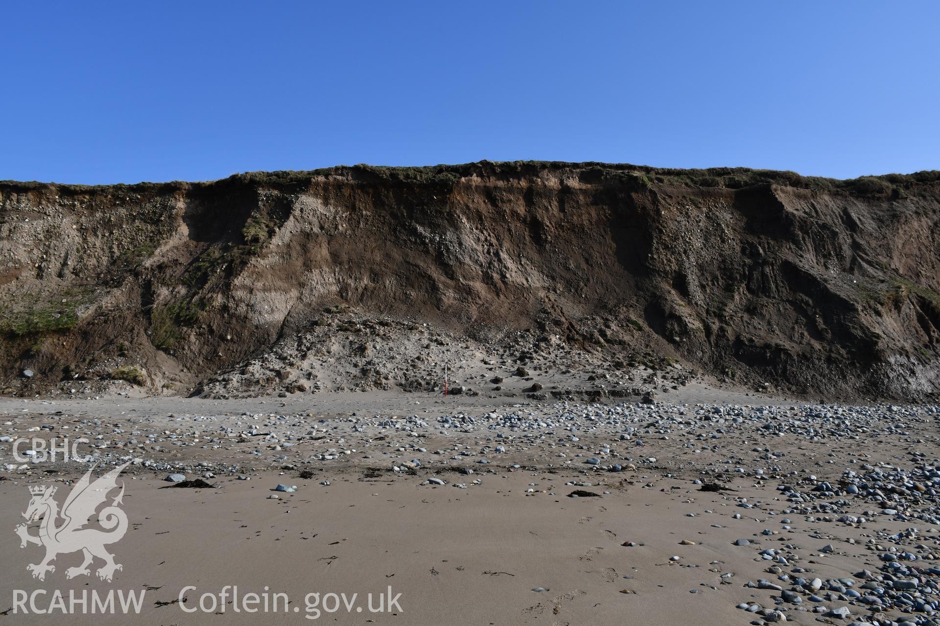 General shot of eroding cliff face with 2m scale. Taken by Toby Driver. Produced with EU funds through the Ireland Wales Co-operation Programme 2014-2023. All material made freely available through the Open Government Licence.