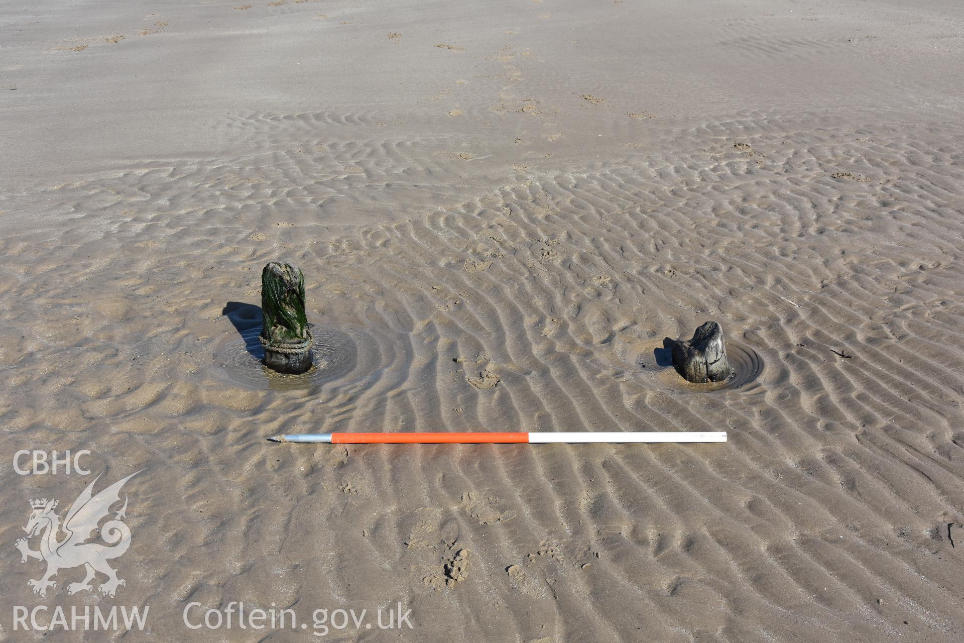 Wide shot of part of a wreck with 2m scale. Photograph taken by Toby Driver in March 2019 as part of repeat monitoring and survey by the CHERISH project. © Crown: CHERISH PROJECT 2019. Produced with EU funds through the Ireland Wales Co-operation Programme 2014-2023. All material made freely available through the Open Government Licence.