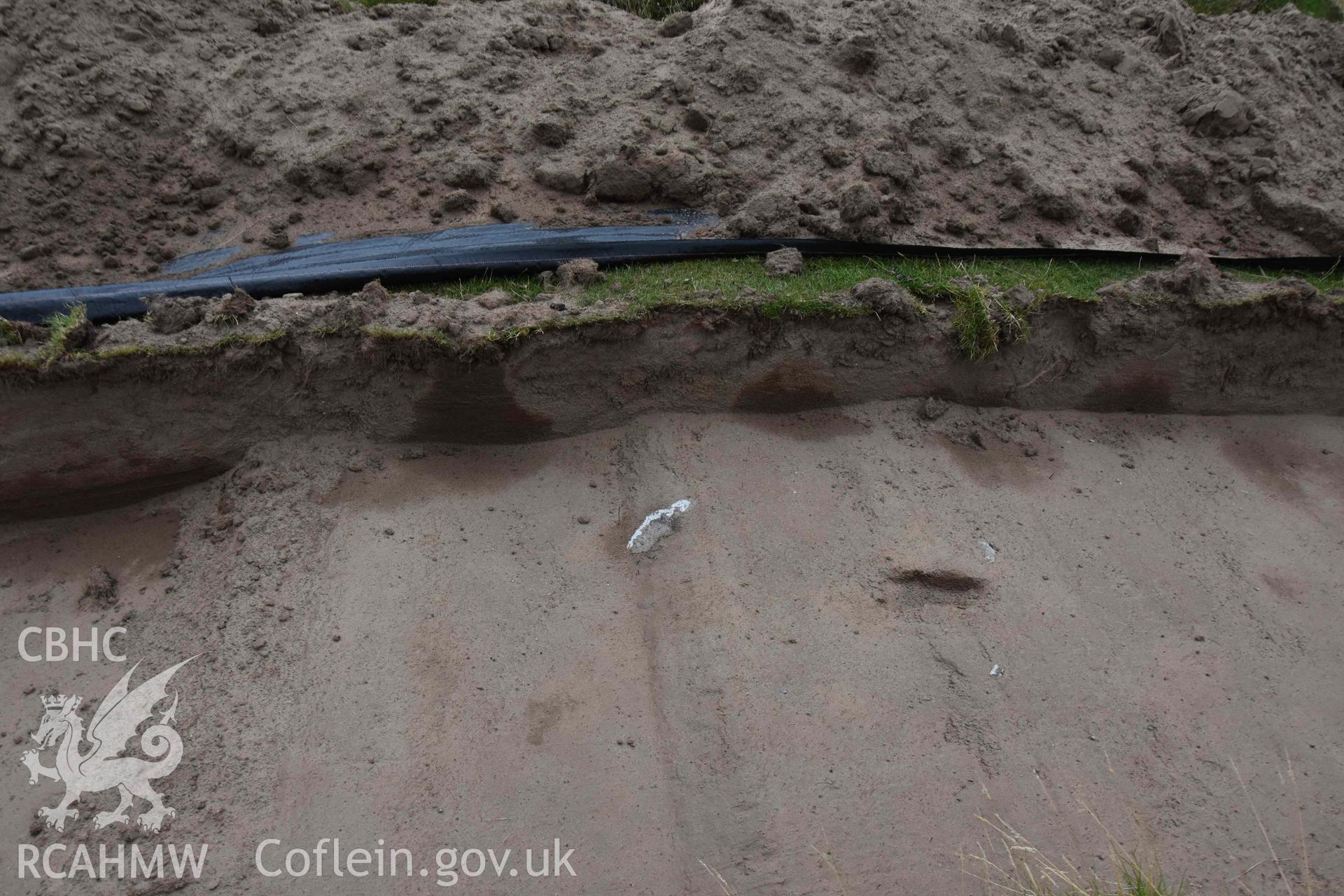 Open trench showing subsoil. Taken by Toby Driver. Produced with EU funds through the Ireland Wales Co-operation Programme 2014-2023. All material made freely available through the Open Government Licence.