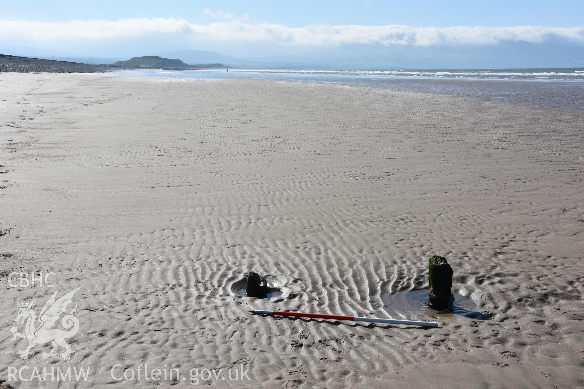 Wide shot of part of an unnamed wreck with 2m scale. Photograph taken by Toby Driver in March 2019 as part of repeat monitoring and survey by the CHERISH project. © Crown: CHERISH PROJECT 2019. Produced with EU funds through the Ireland Wales Co-operation Programme 2014-2023. All material made freely available through the Open Government Licence.