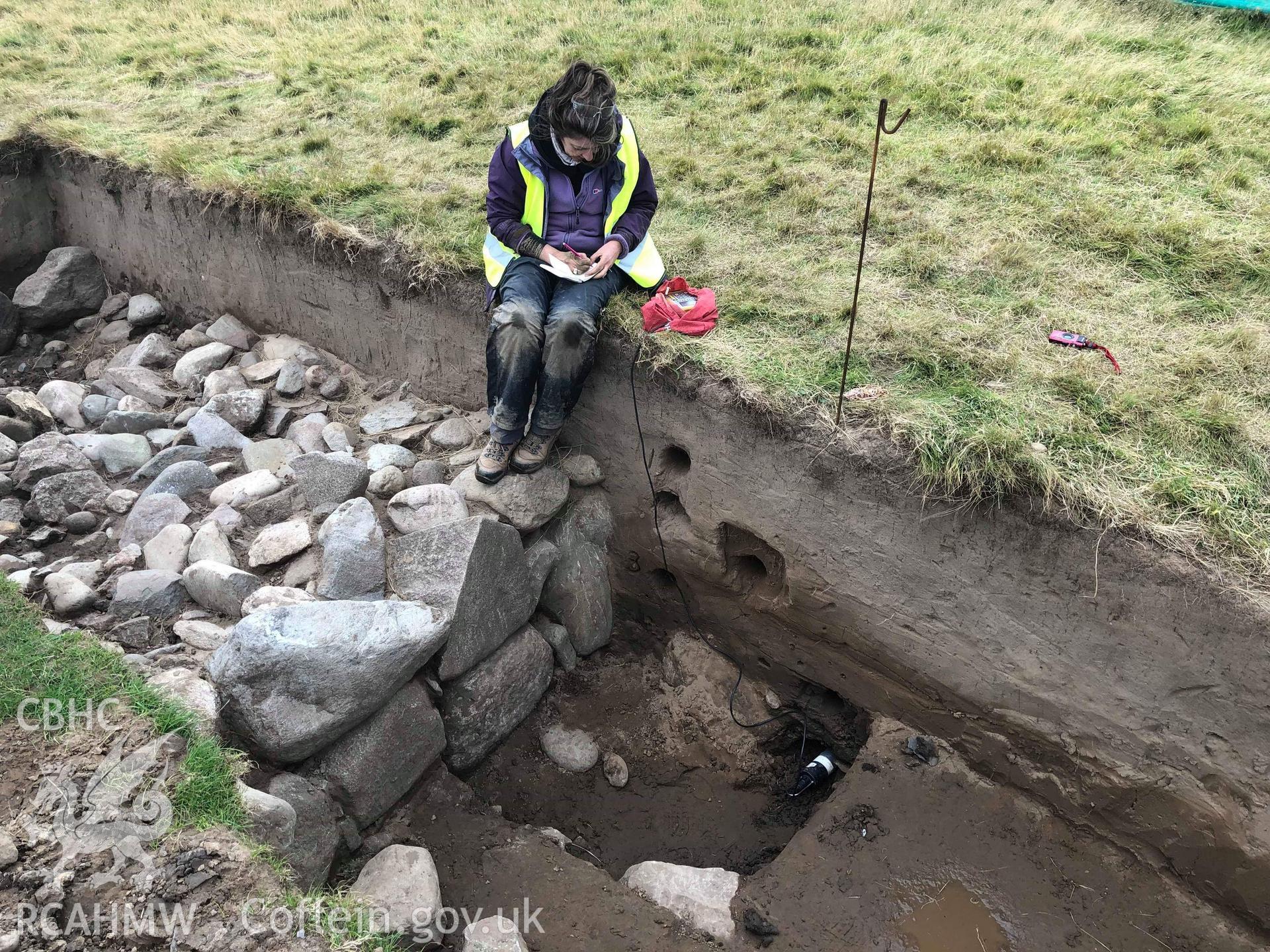 CHERISH team member taking samples in trench Taken by Toby Driver. Produced with EU funds through the Ireland Wales Co-operation Programme 2014-2023. All material made freely available through the Open Government Licence.
