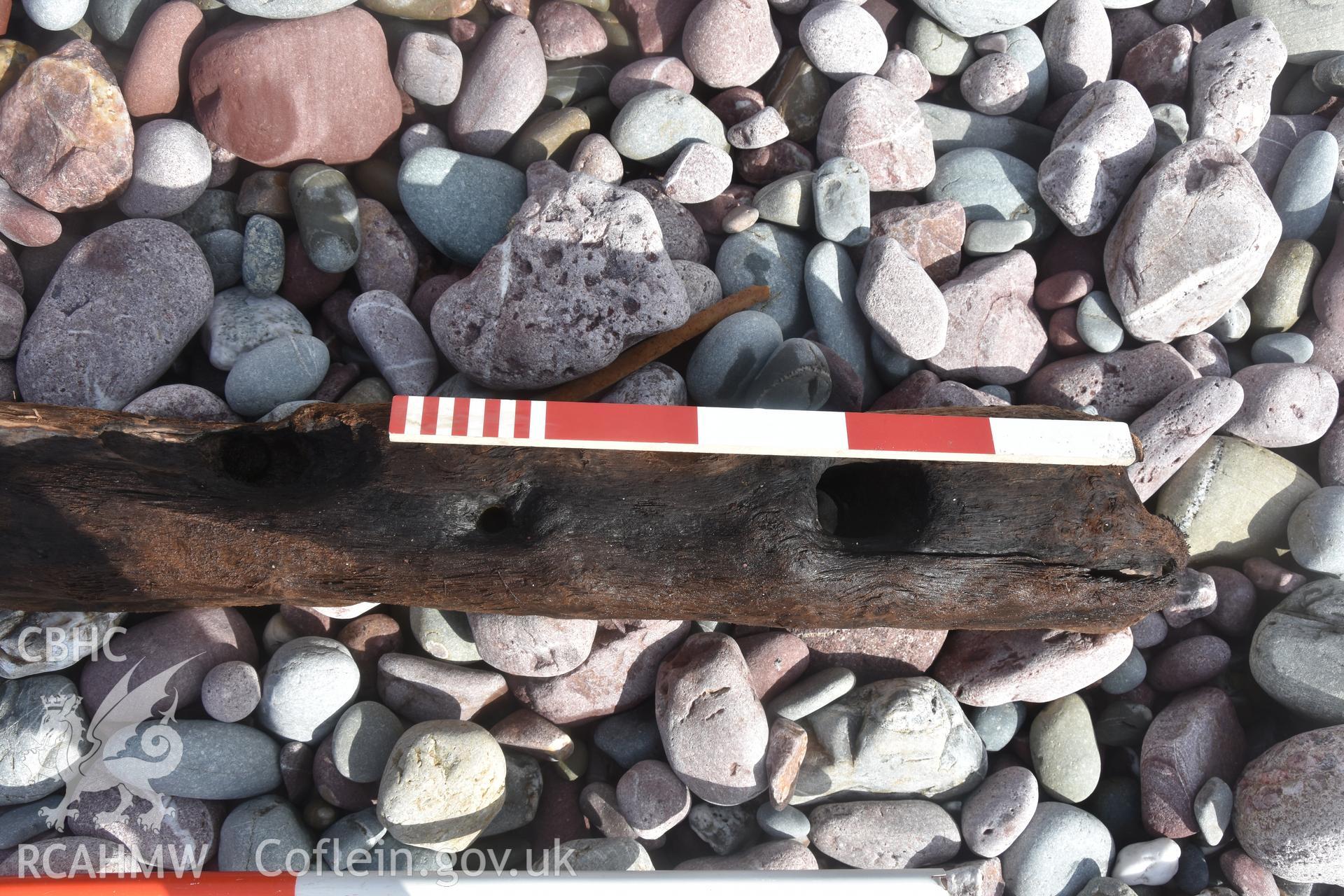 Wood from the wreck with 1m scale and 0.5m scale Taken by Daniel Hunt. Produced with EU funds through the Ireland Wales Co-operation Programme 2014-2023. All material made freely available through the Open Government Licence.