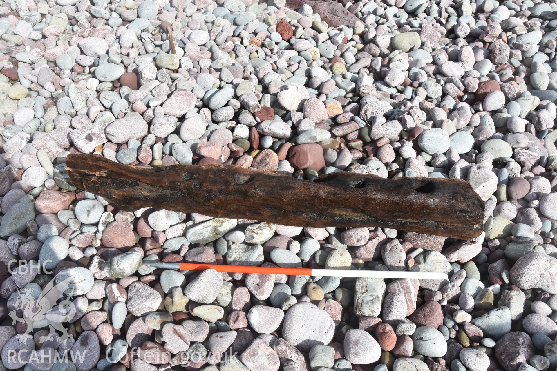 Wood from the wreck with 1m scale Taken by Daniel Hunt. Produced with EU funds through the Ireland Wales Co-operation Programme 2014-2023. All material made freely available through the Open Government Licence.