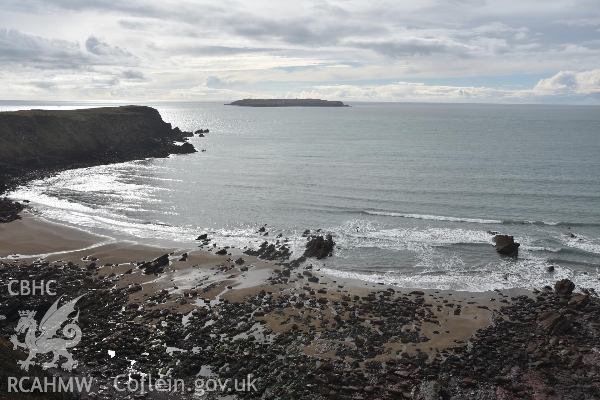 Beach with wreck emerging from the waves Taken by Daniel Hunt. Produced with EU funds through the Ireland Wales Co-operation Programme 2014-2023. All material made freely available through the Open Government Licence.