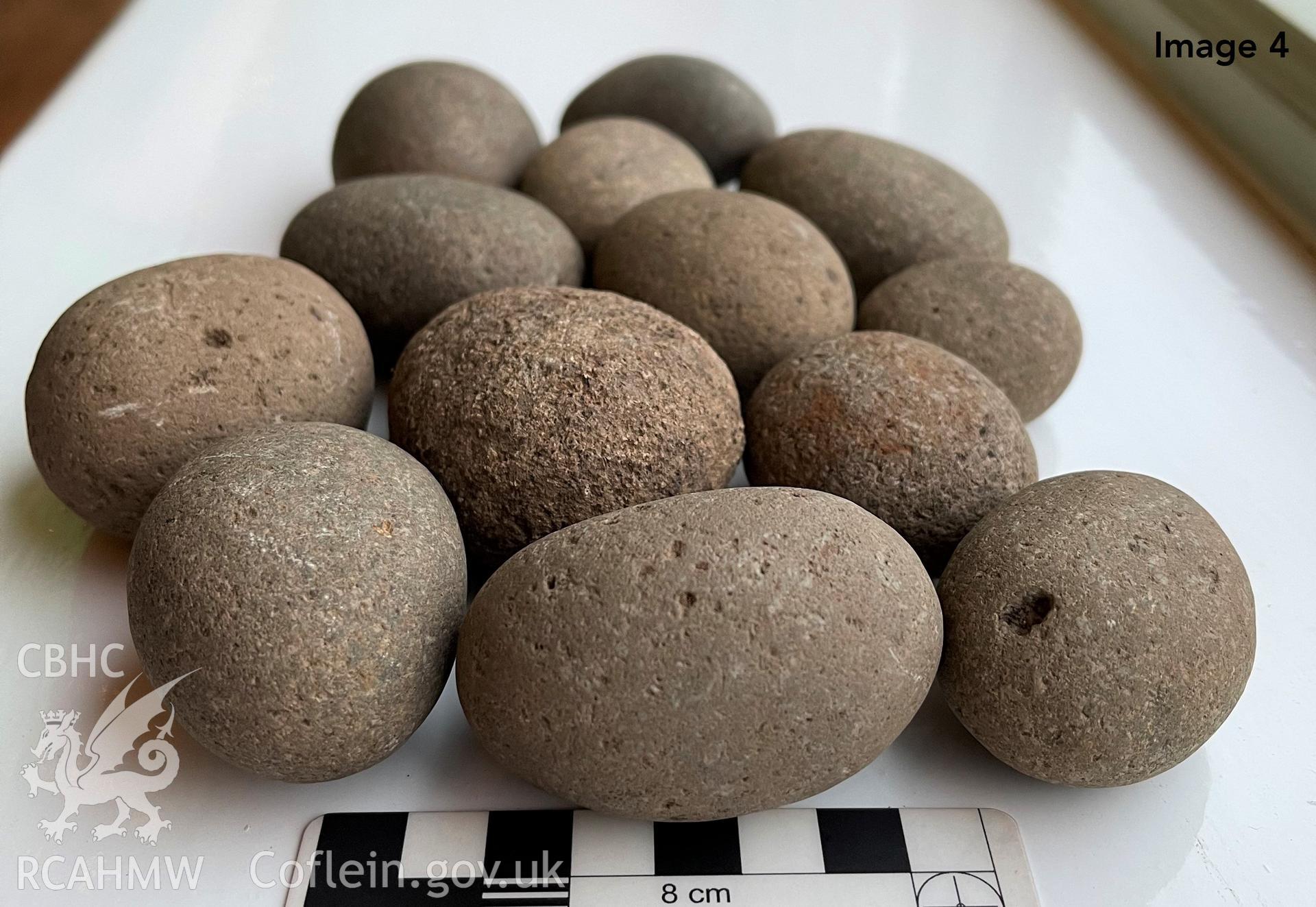 Slingshot stones found at Caerfai promontory fort during 2021 excavations Taken by Louise Barker. Produced with EU funds through the Ireland Wales Co-operation Programme 2014-2023. All material made freely available through the Open Government Licence.