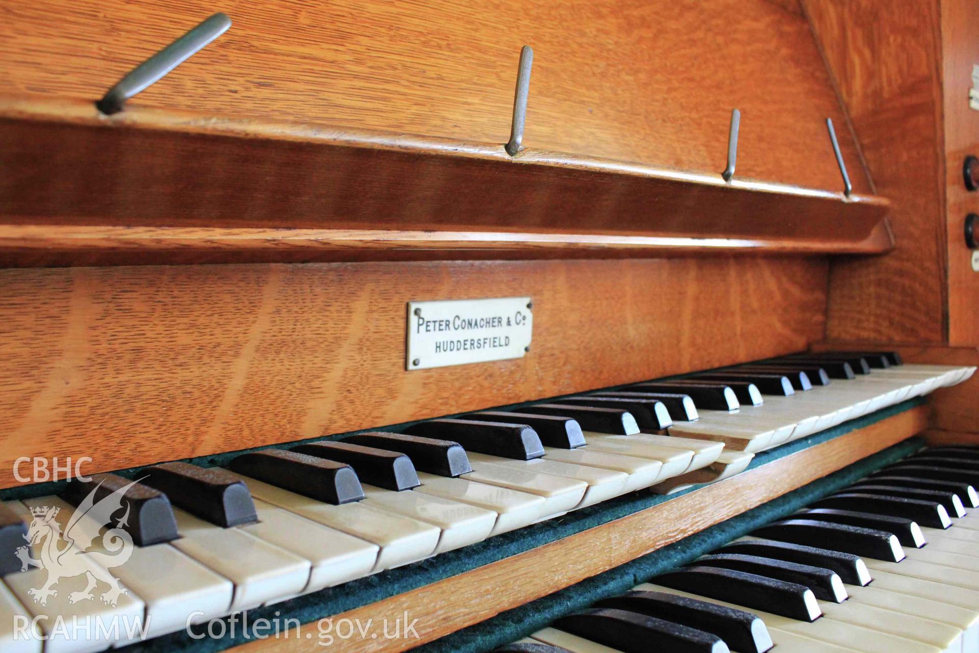 Organ keys and maker plaque: Peter Conacher & Co. Huddersfield.