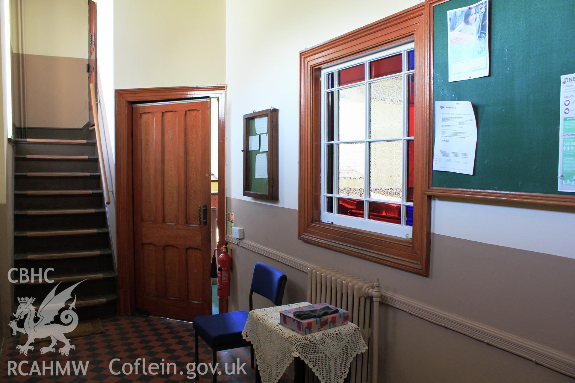 Main foyer. Window, door and stairs.