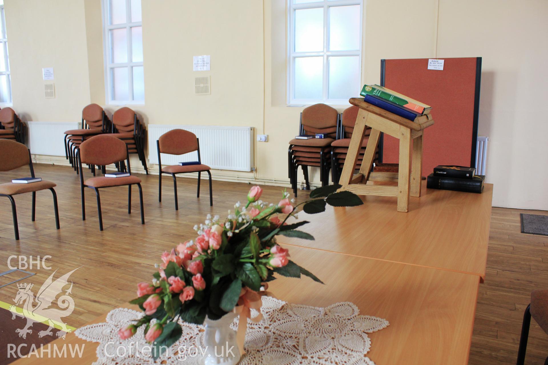 Vestry front table, flowers and lectern.