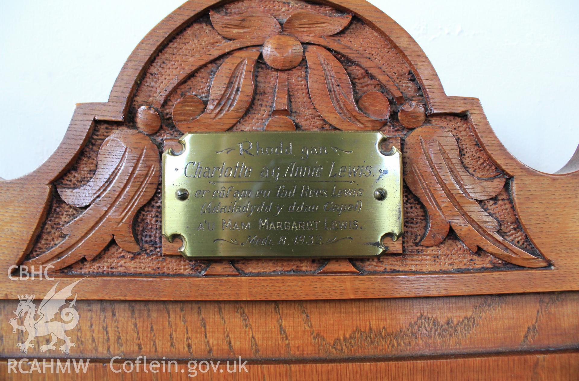 Chair plaque: 'Rhodd gan Charlotte ag Annie Lewis er côf am eu Tad Rees Lewis (Adailadydd y ddau Capel) A'U MAM MARGARET LEWIS Medi 8 1932. Gift by Charlotte and Annie Lewis in remembrance of their father Rees Lewis (builder of both chapels) AND THEIR MOTHER MARGARET LEWIS. September 8 1932.