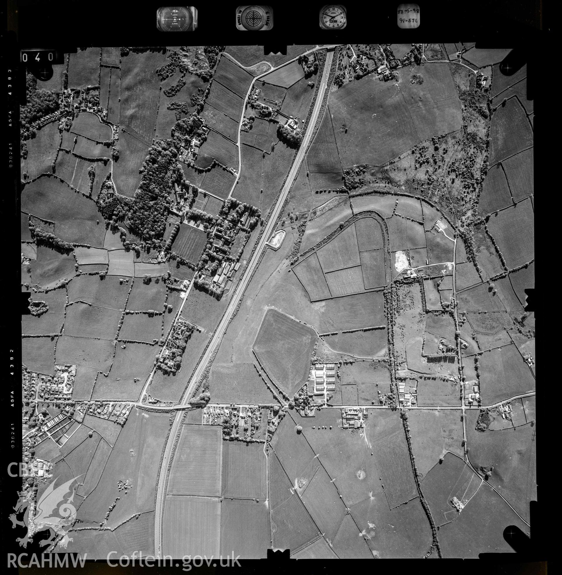 Digitized copy of an aerial photograph showing an area near Holywell, taken by Ordnance Survey, 1997. [Flight: 98-576 Fr 040].