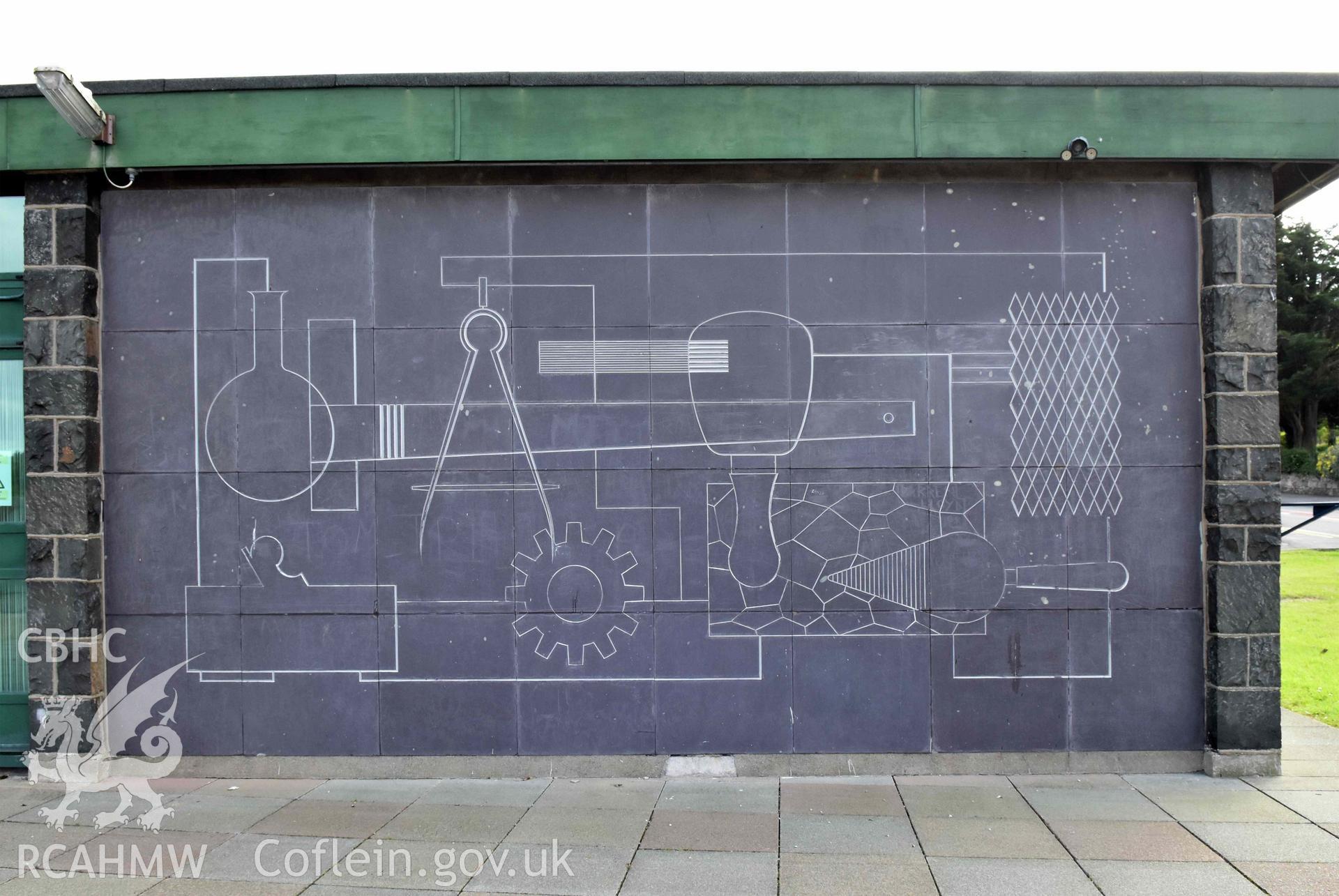 Digital colour photograph showing Caernarfonshire Technical College; detail of slate mural to entrance, taken by Susan Fielding of RCAHMW 7 May 2019.