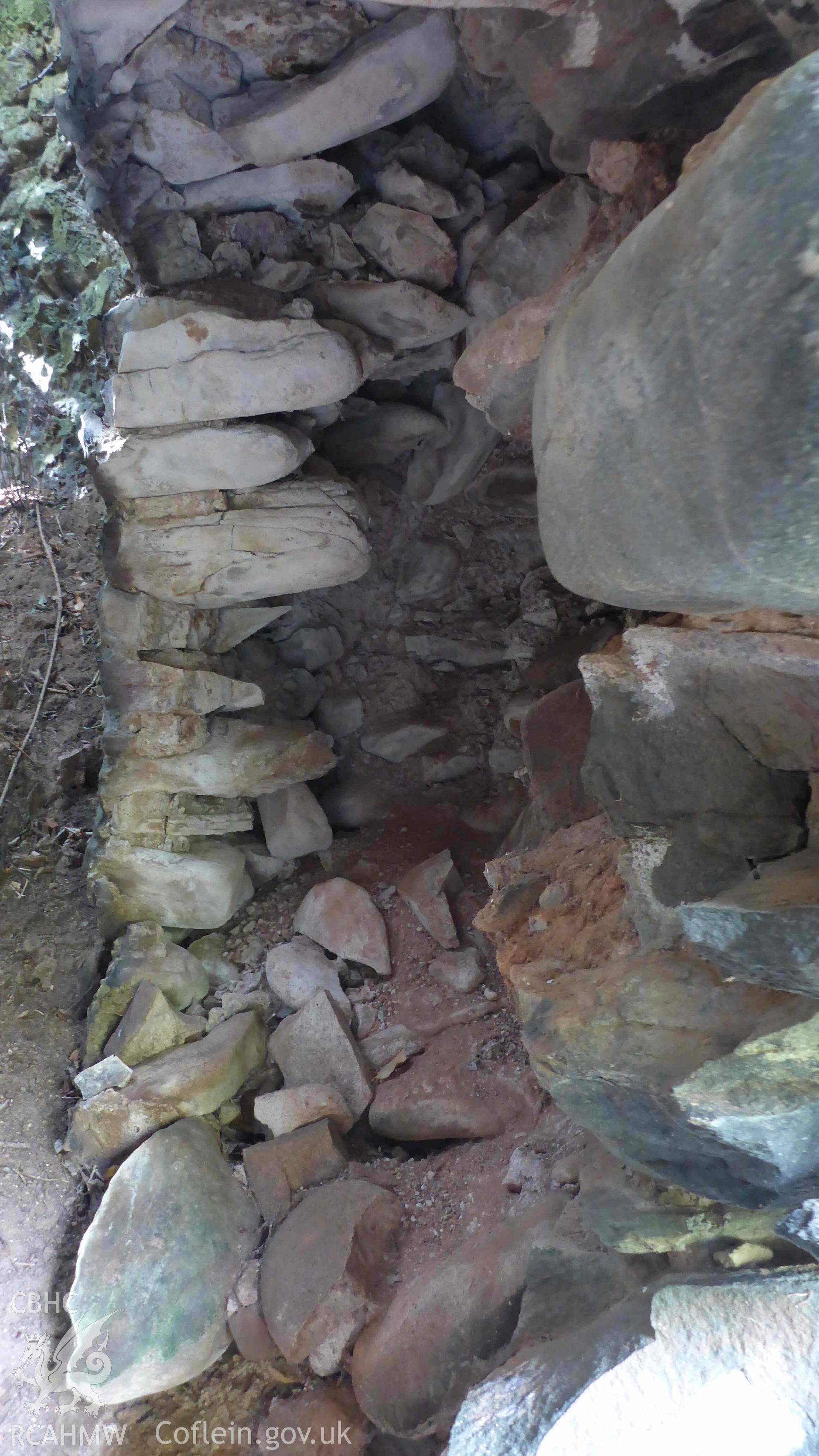 Digital colour photograph showing Craiglas Lime Kilns - lime Kiln 1, collapsed wall of north-east facing kiln-eye. Crucible is to the left, kiln-eye to the right.