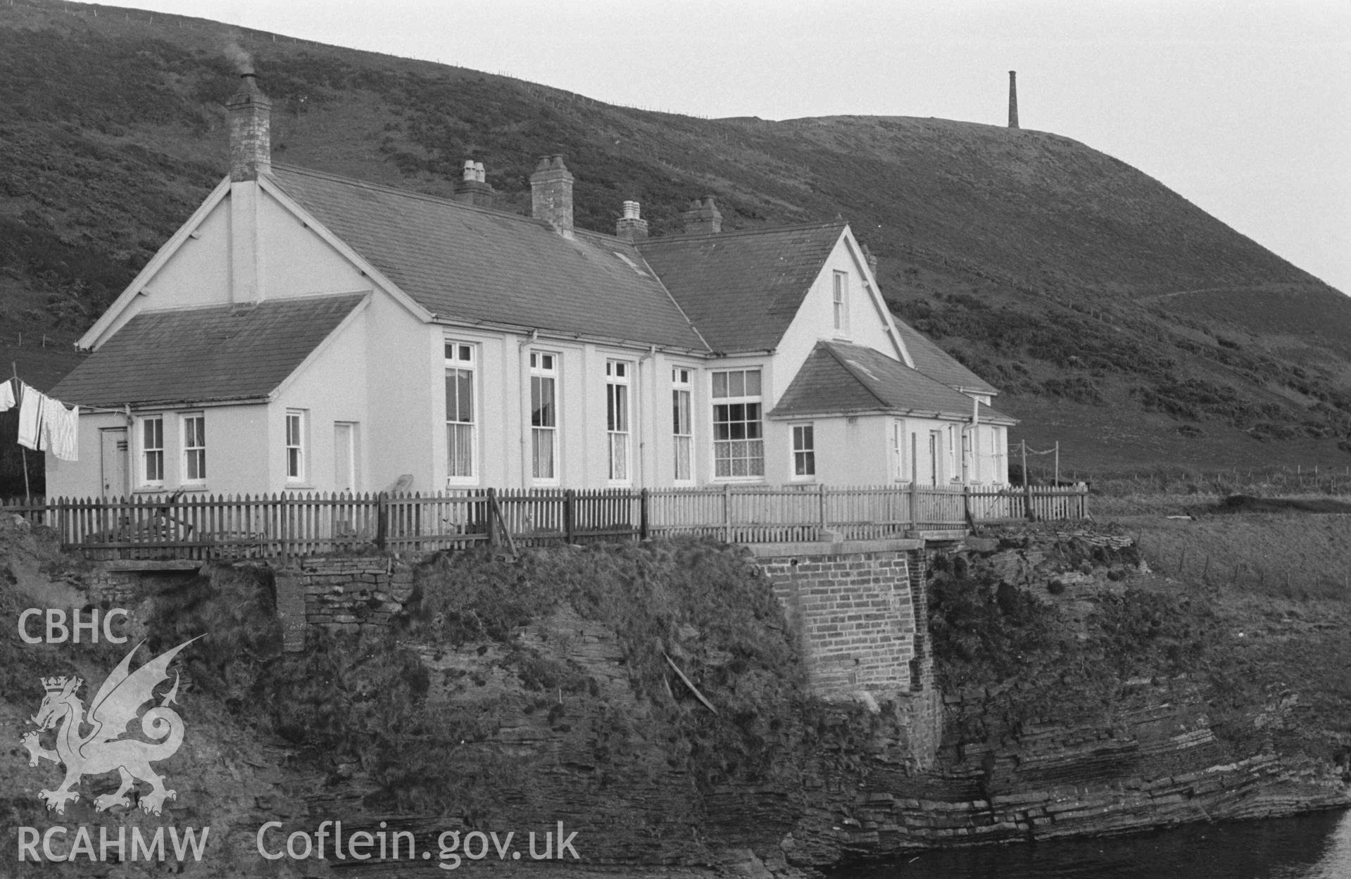 Digital copy of a black and white negative showing former isolation hospital at Pen-yr-Angor near Tanybwlch beach, Aberystwyth. Photographed by Arthur Chater on 13 April 1968. Looking south from Grid Reference SN 579 806.