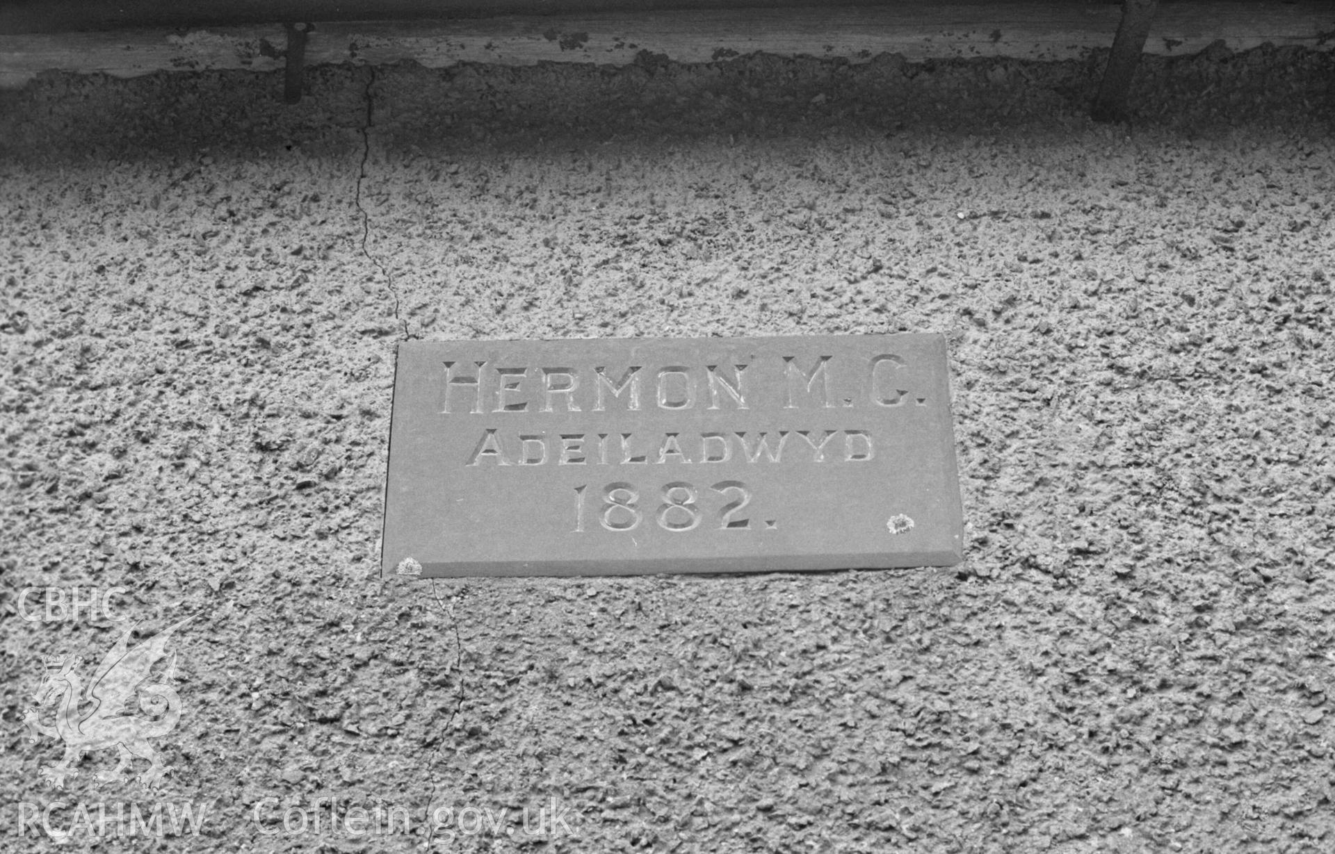 Digital copy of a black and white negative showing slate plaque on the front of Hermon Chapel, 1.5km north north west of Trefilan. Photographed by Arthur Chater on 13 April 1968. Grid Reference SN 544 586.
