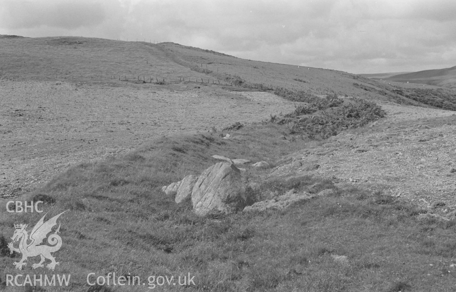 Digital copy of a black and white negative showing view looking across boundary bank between the parishes of Llanafan and Upper Llanfihangel-y-Creuddyn, 400m north east of Pen Grogwynion; boundary stone in foreground. Photographed by Arthur Chater on 17 August 1968. Looking north west from Grid Reference SN 725 729.