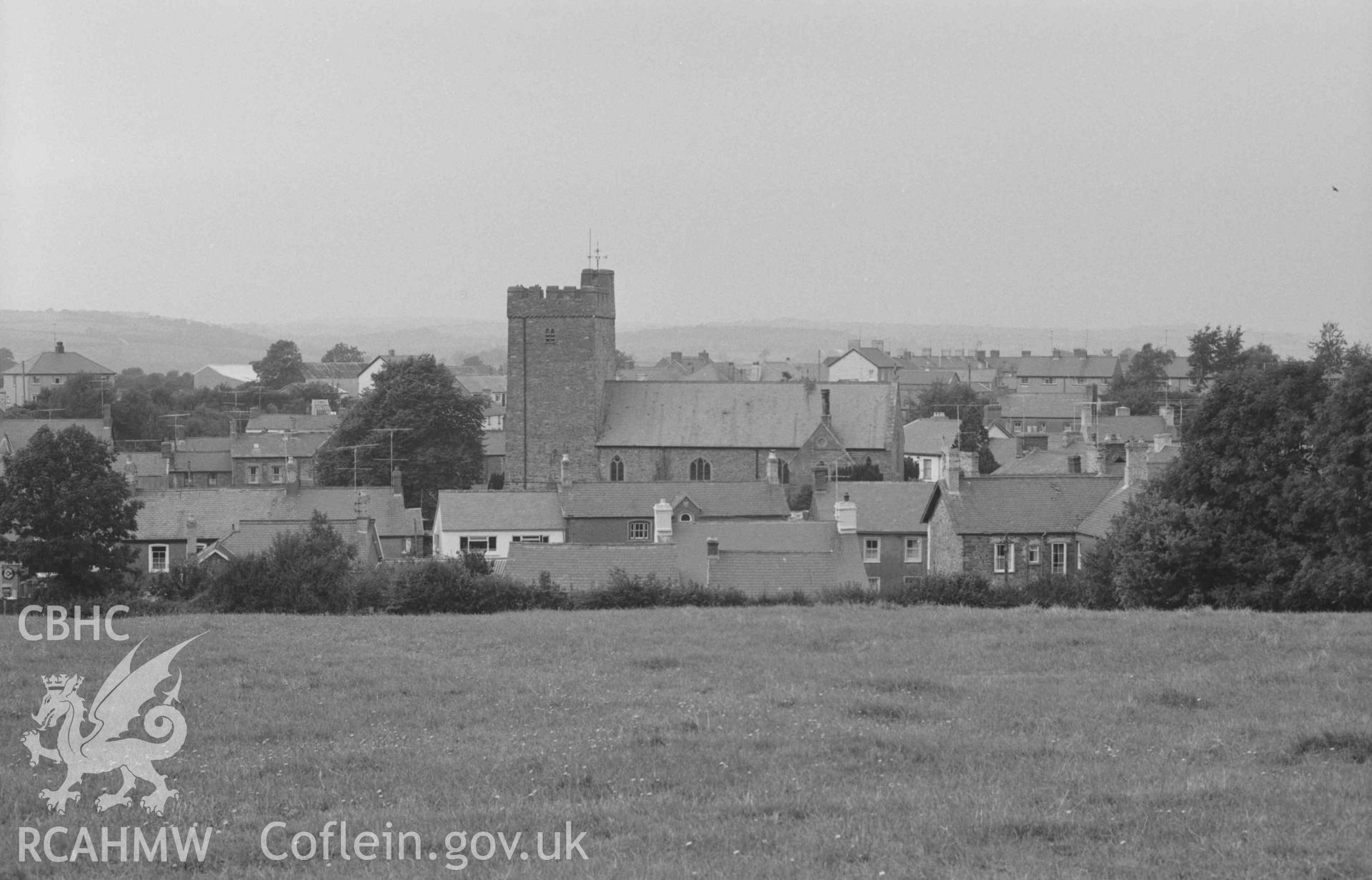 Digital copy of a black and white negative showing church and town from the lane nehinf the Wesleyan Chapel. Photographed by Arthur Chater on 29 August 1968. Looking north west from Grid Reference SN 681 596.