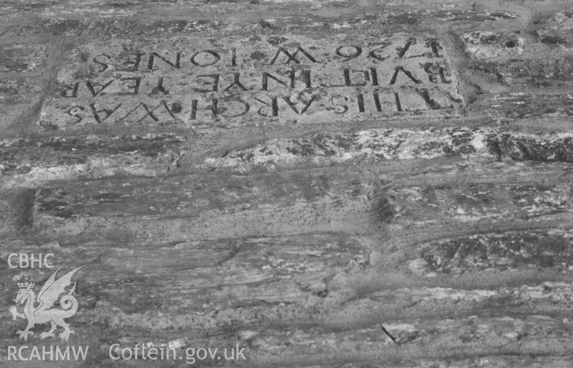 Digital copy of a black and white negative showing inscription on stone above cut-water on east side of Cardigan Bridge. Photographed by Arthur Chater on 30 August 1968. Looking west from Grid Reference SN 1778 4581.