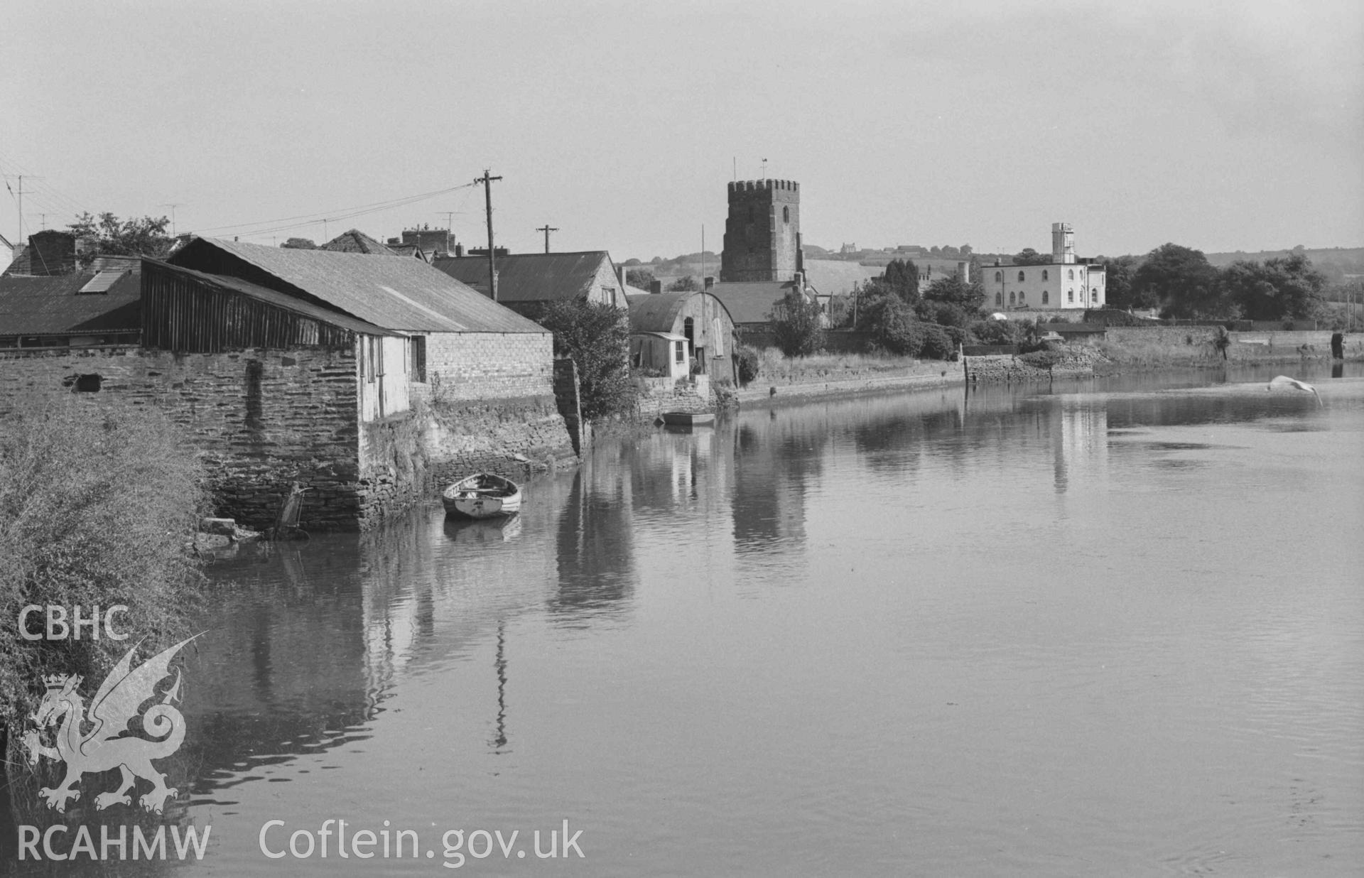 Digital copy of a black and white negative showing view up the Teifi to the church from the north end of the bridge. Photographed by Arthur Chater on 30 August 1968. Looking east north east from Grid Reference SN 1778 4584.