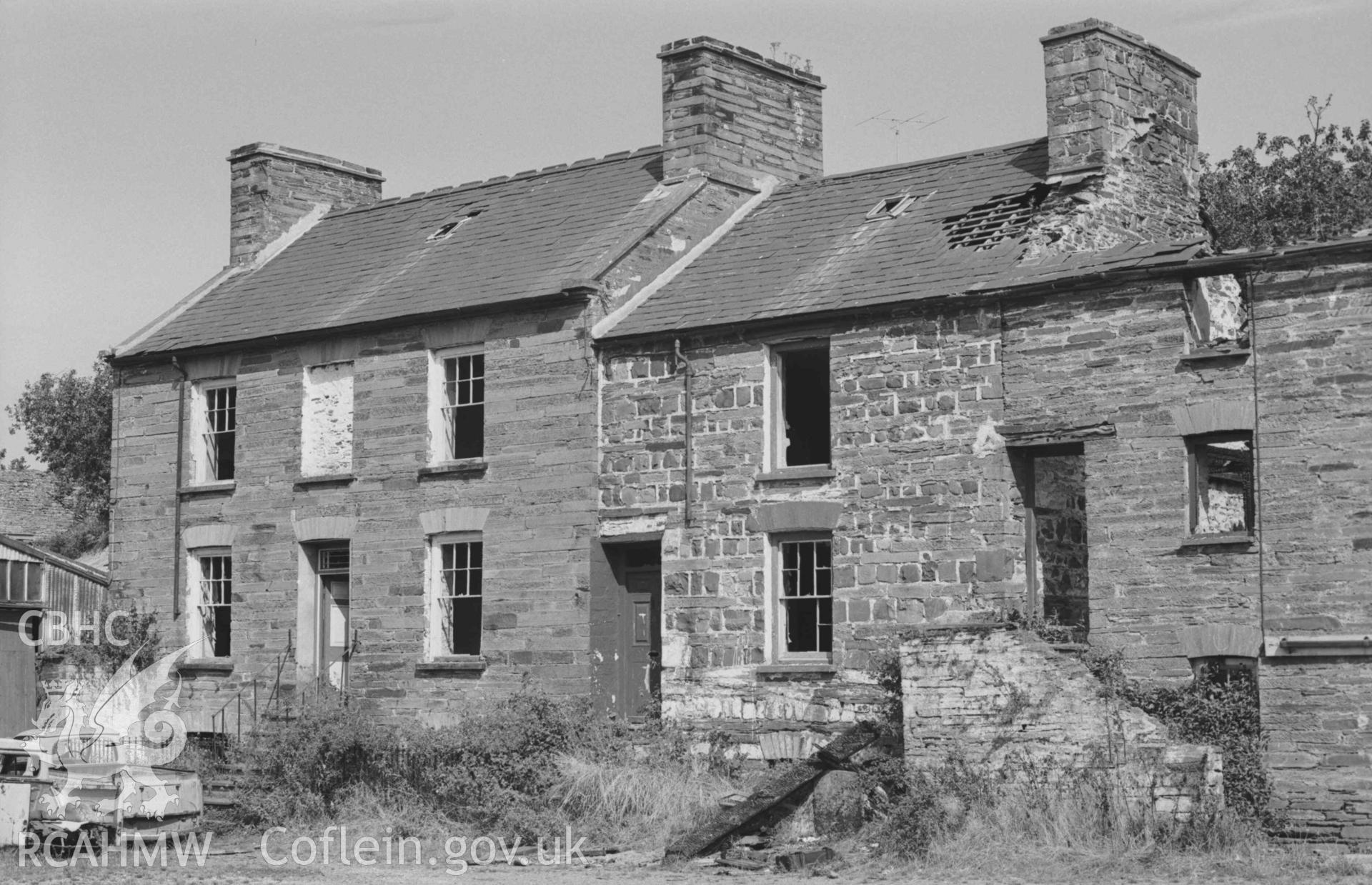 Digital copy of a black and white negative showing ruined houses at the east end of Cambrian Quay, behind the Grosvenor Hotel. Photographed by Arthur Chater on 30 August 1968. Looking north west from Grid Reference SN 1768 4589.