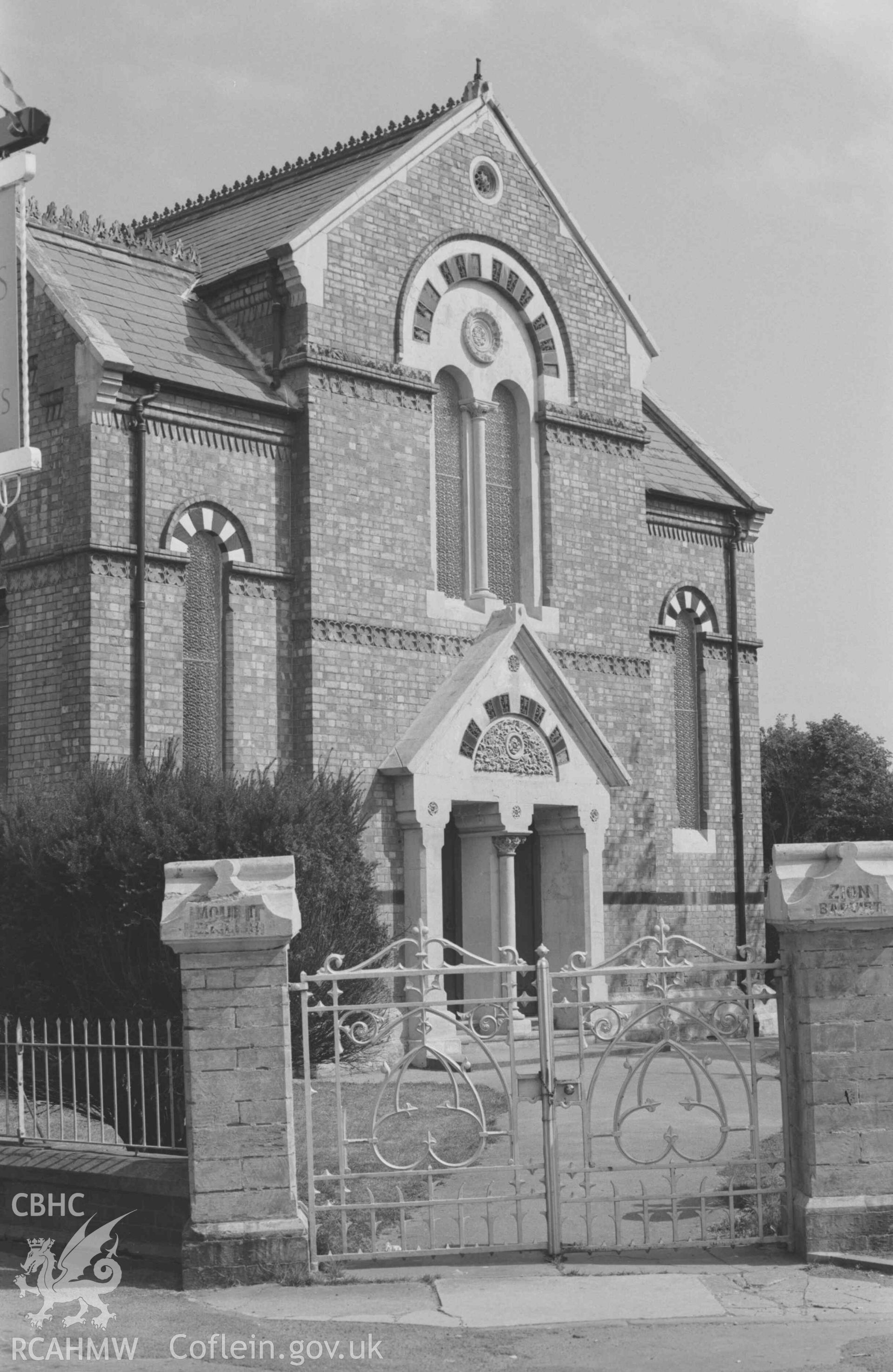 Digital copy of a black and white negative showing the front of Mount Zion Baptist Chapel, Priory Street, from outside the gate. Photographed by Arthur Chater on 30 August 1968. Looking north east from Grid Reference SN 1785 4614.