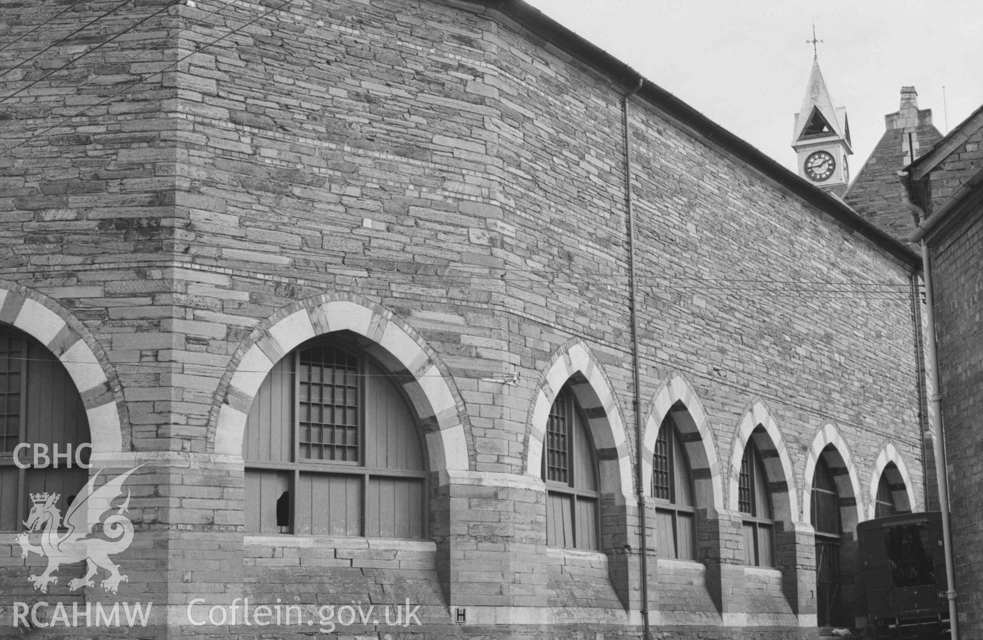 Digital copy of a black and white negative showing the back of the market, behind the Guildhall, from the junction of Queen's Terrace and College Row, Cardigan. Photographed by Arthur Chater on 30 August 1968. Looking north east from Grid Reference SN 1772 4618.
