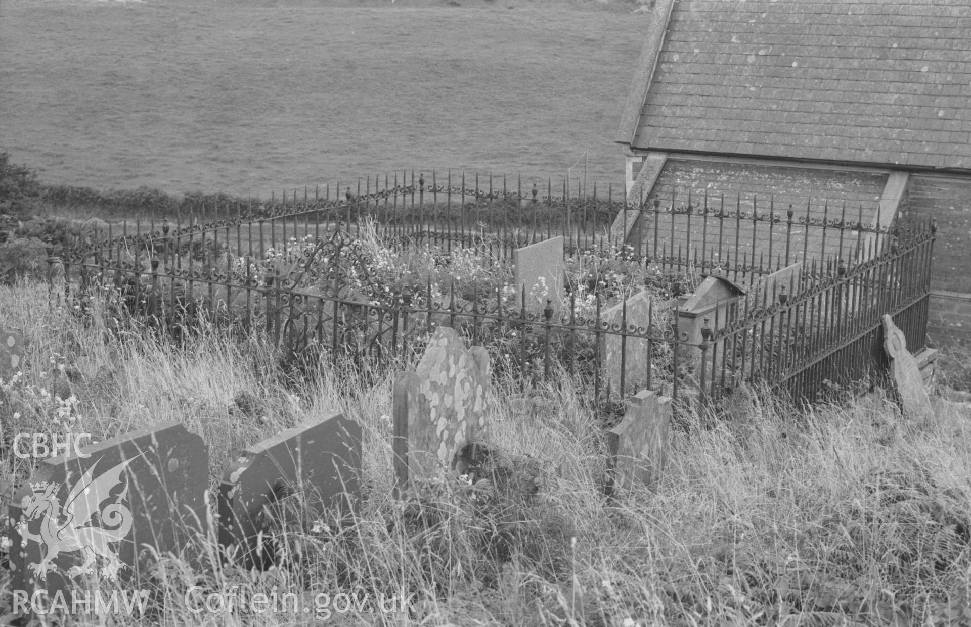 Digital copy of a black and white negative showing the complete grave enclosure of the Evans family, c. 1850, in the churchyard to the north of the chancel at St Pedrog's Church. Photographed by Arthur Chater on 30 August 1968. Looking south south east from Grid Reference SN 183 496.