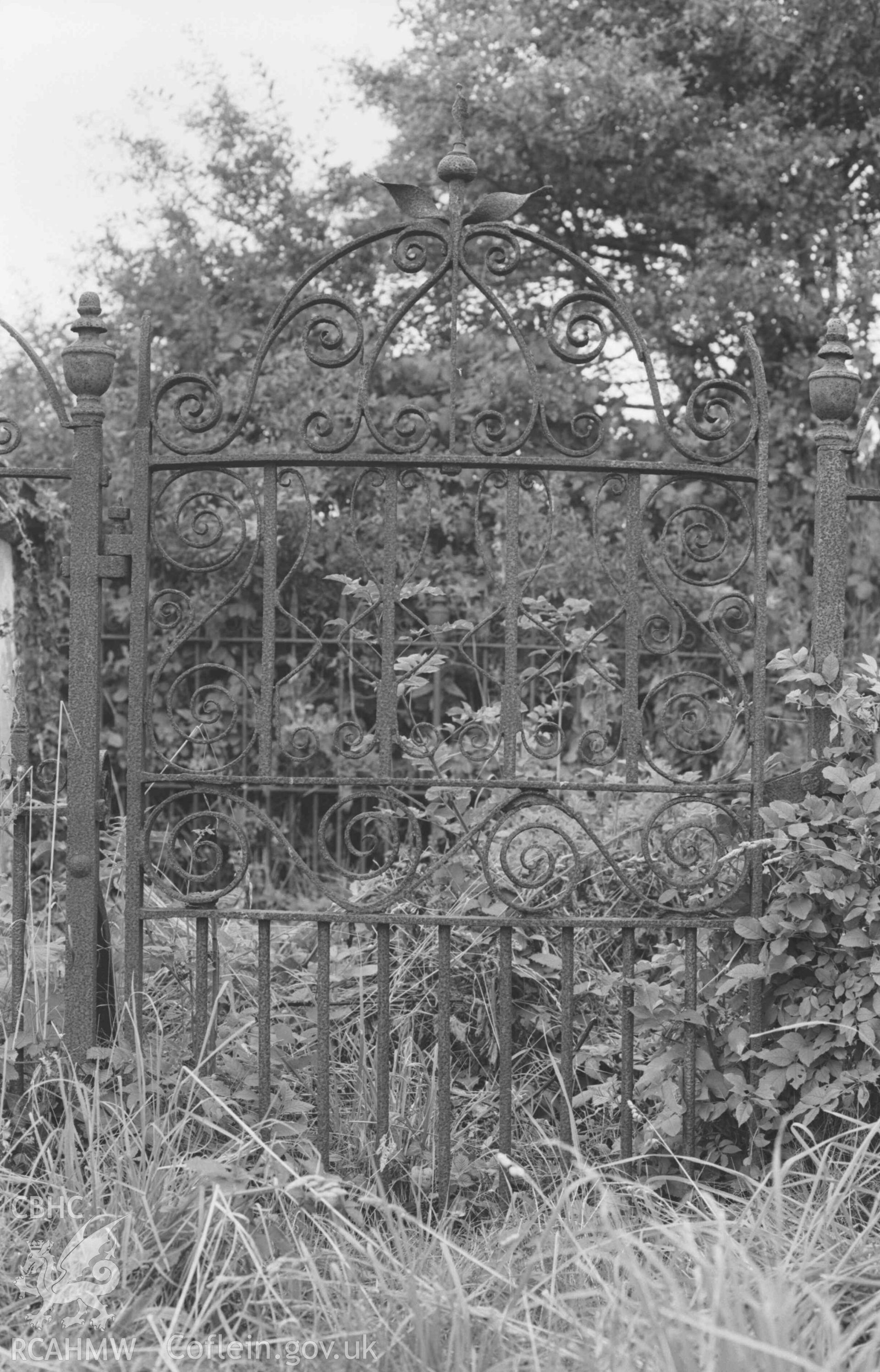 Digital copy of a black and white negative showing wrought iron gate to grave enclosure of Elizabeth Davies, d. 1881, in Siloam Chapel graveyard. Photographed by Arthur Chater on 30 August 1968. Looking north from Grid Reference SN 185 496.
