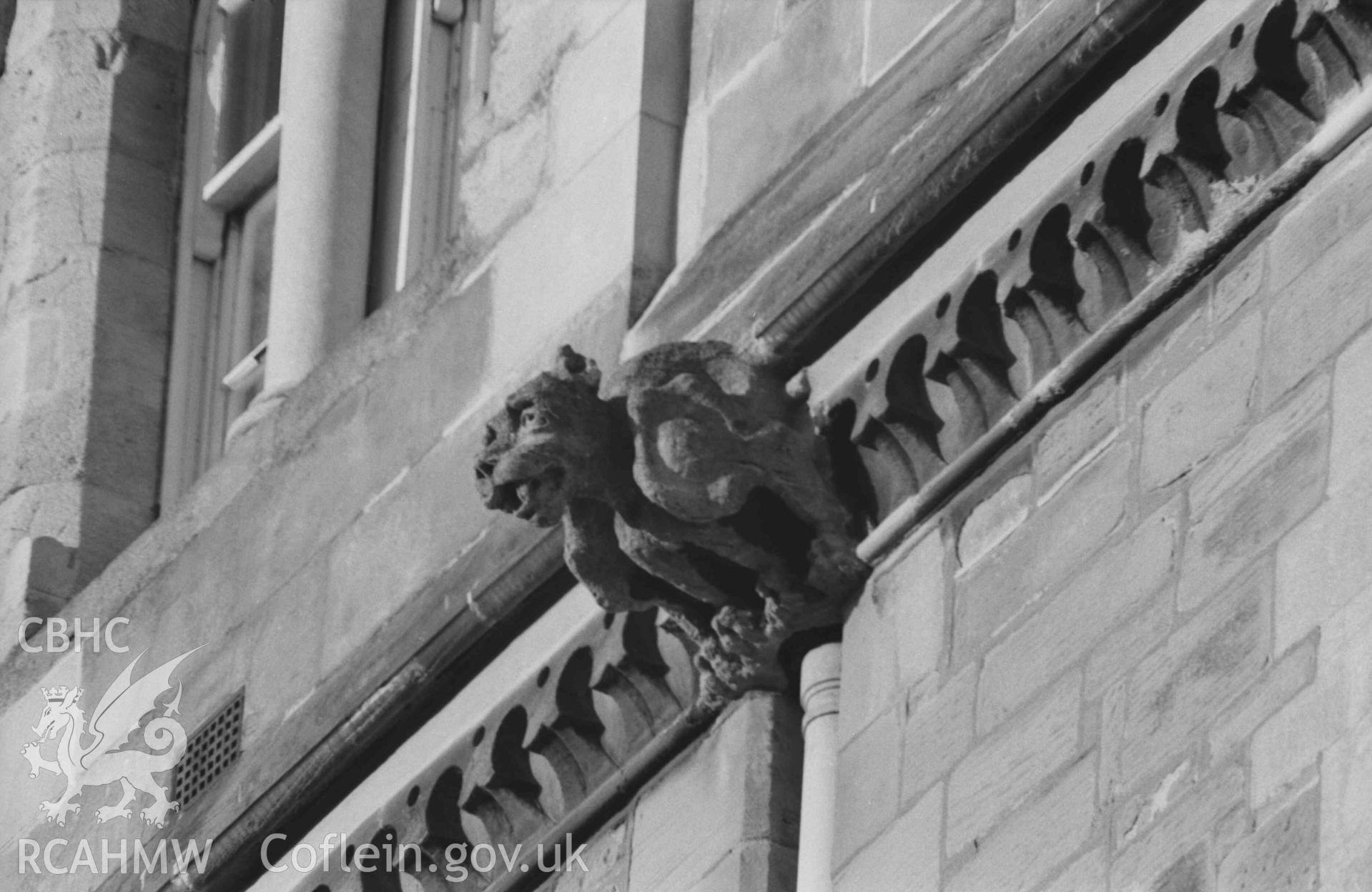 Digital copy of a black and white negative showing gargoyles on the south east side of the University College Wales building overlooking King Street (telephoto). Photographed by Arthur Chater on 27 December 1968. Looking north west from Grid Reference SN 5810 8170.