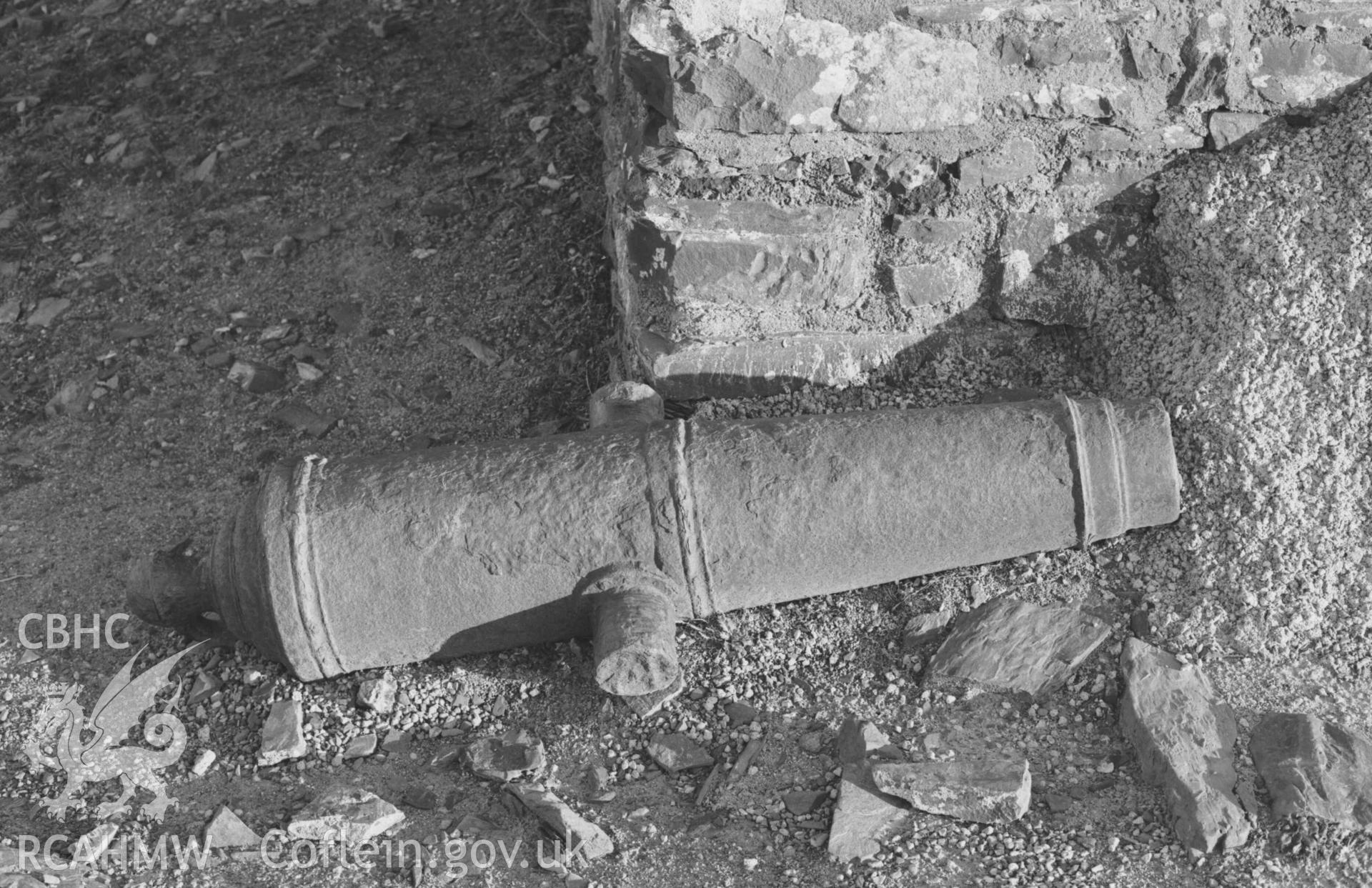 Digital copy of a black and white negative showing canon lying by castle ruins - one of two similar ones. Photographed by Arthur Chater on 27 December 1968. Grid Reference SN 5793 8154.