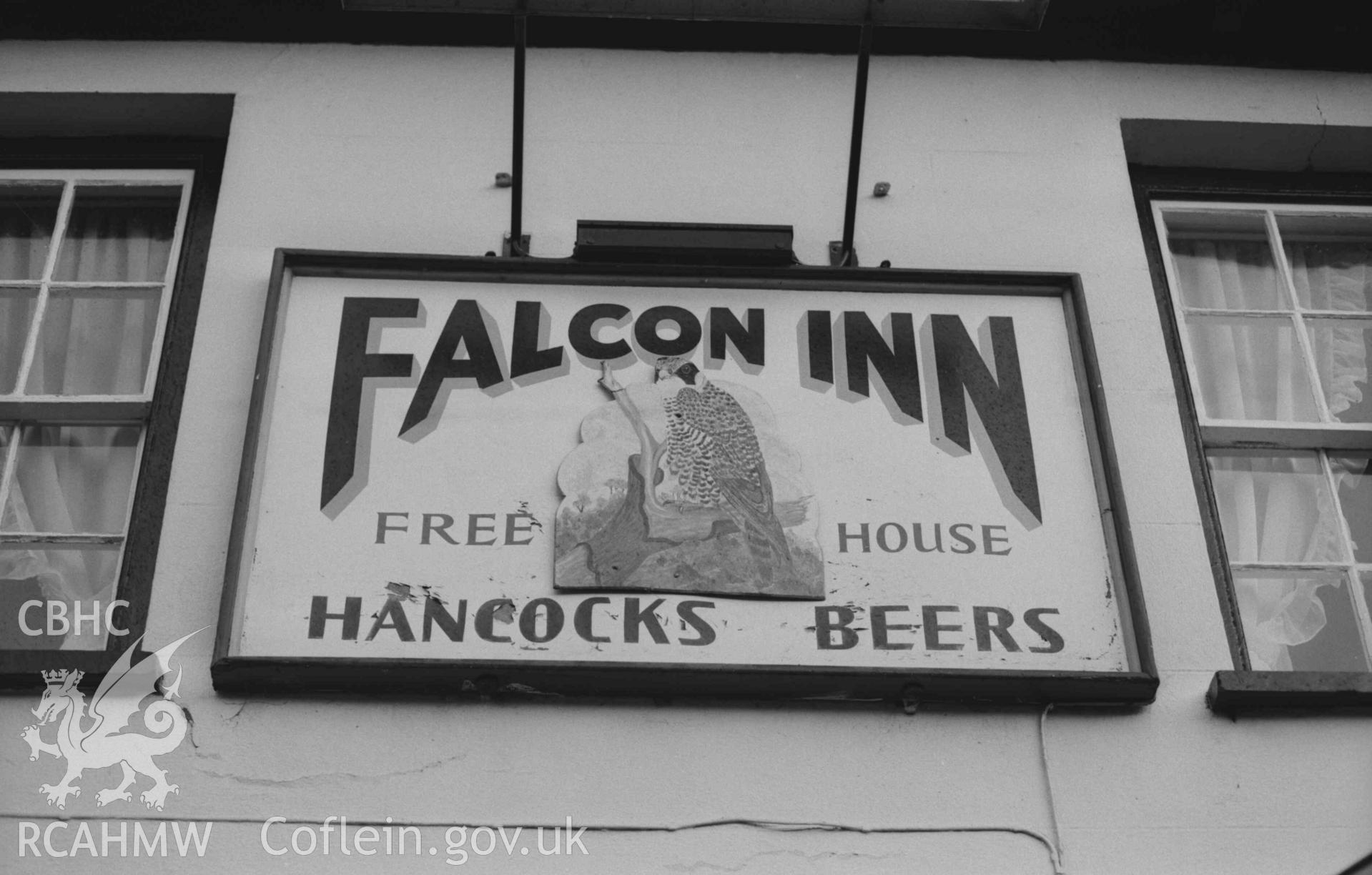 Digital copy of a black and white negative showing signboard of the Falcon Inn, Llanilar. Photographed by Arthur Chater on 27 December 1968. Looking east from Grid Reference SN 6238 7505.