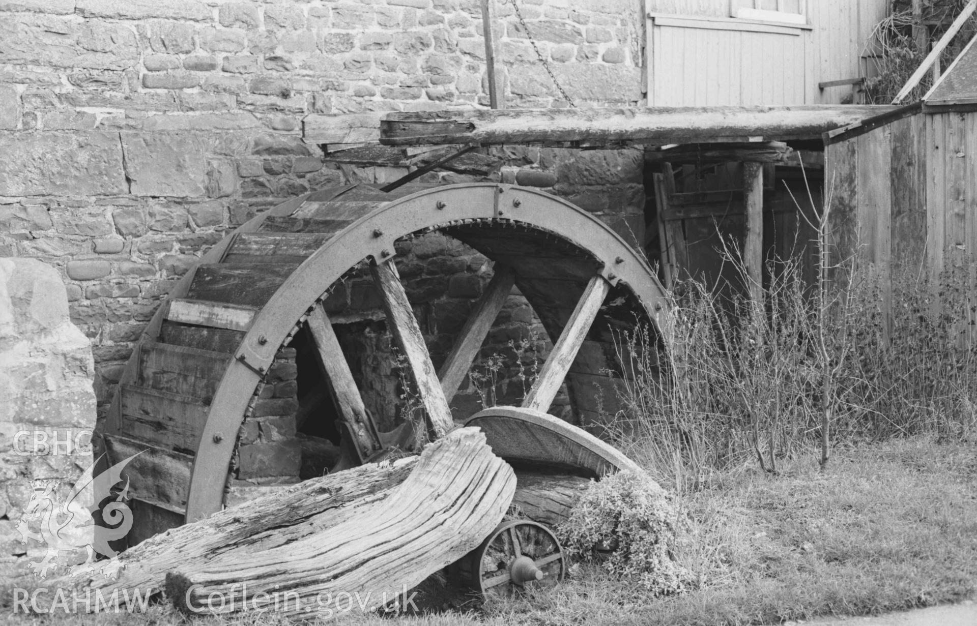 Digital copy of a black and white negative showing mill wheel (overshot) of the mill on the east side of the Arth. Photographed by Arthur Chater on 28 December 1968. Looking east from Grid Reference SN 4795 6384.