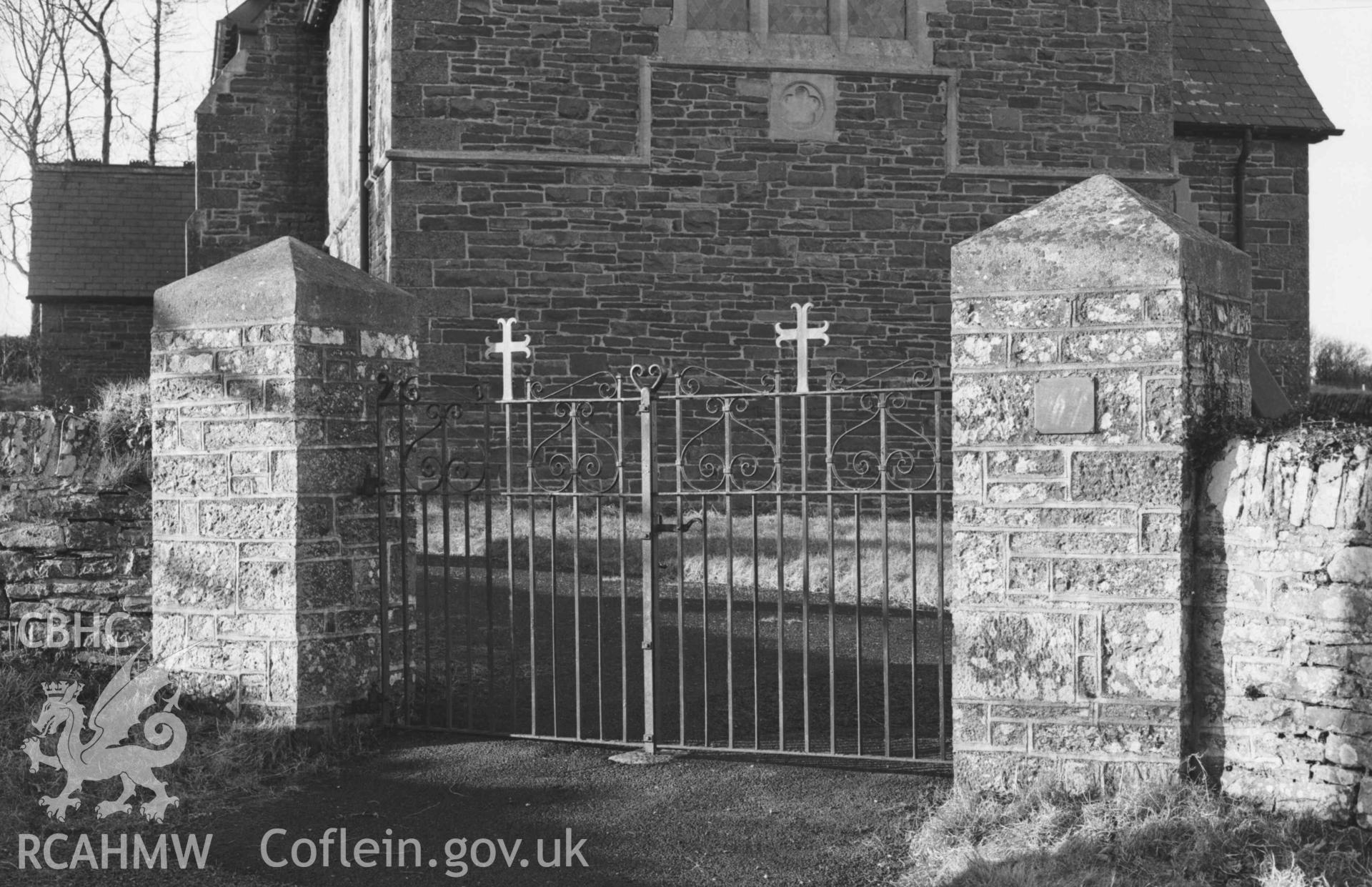 Digital copy of a black and white negative showing gate at the south east corner of Llangwyryfon churchyard. Photographed by Arthur Chater on 30 December 1968. Looking west north west from Grid Reference SN 5965 7052.