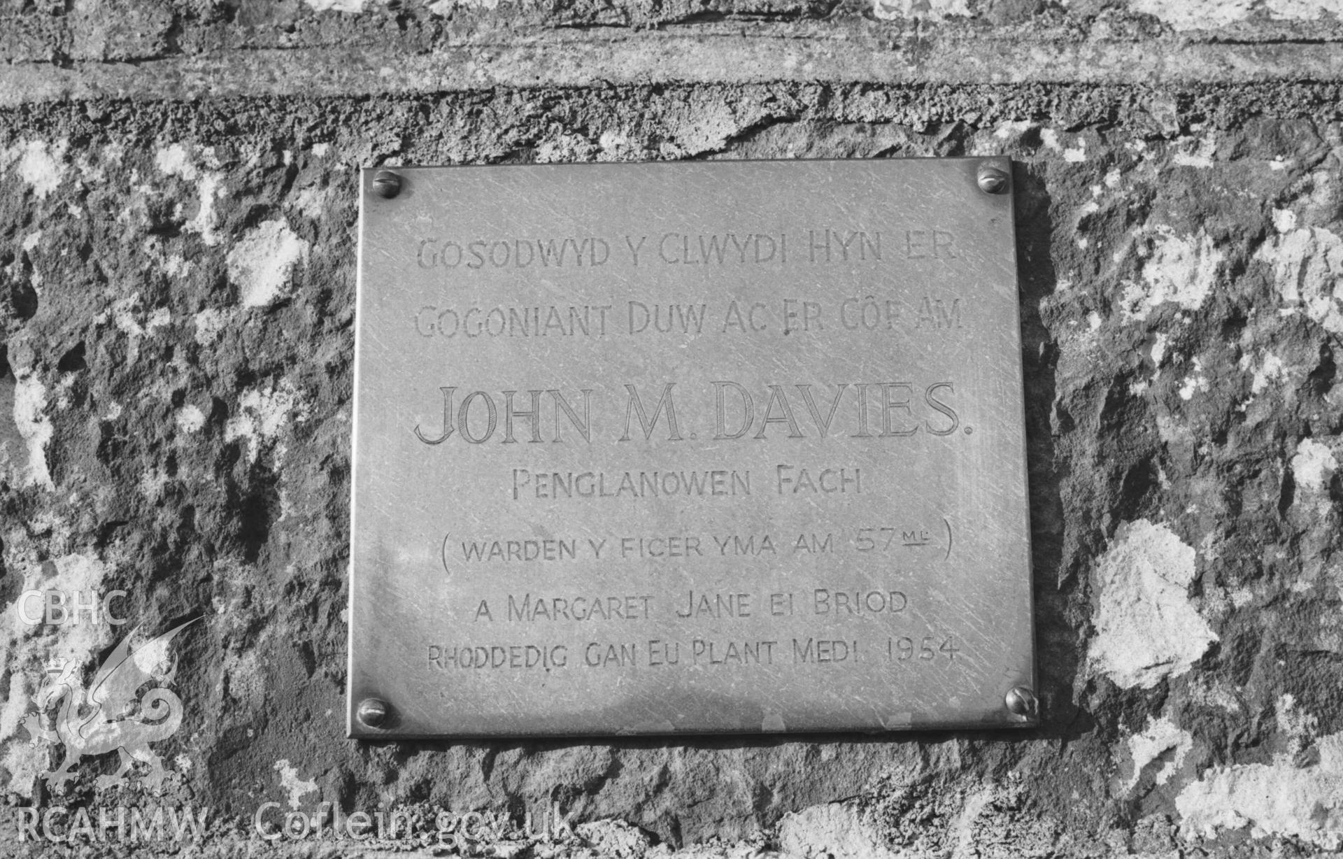 Digital copy of a black and white negative showing brass plaque on gatepost at the south east corner of Llangwyryfon churchyard. Photographed by Arthur Chater on 30 December 1968. Grid Reference SN 5965 7052.
