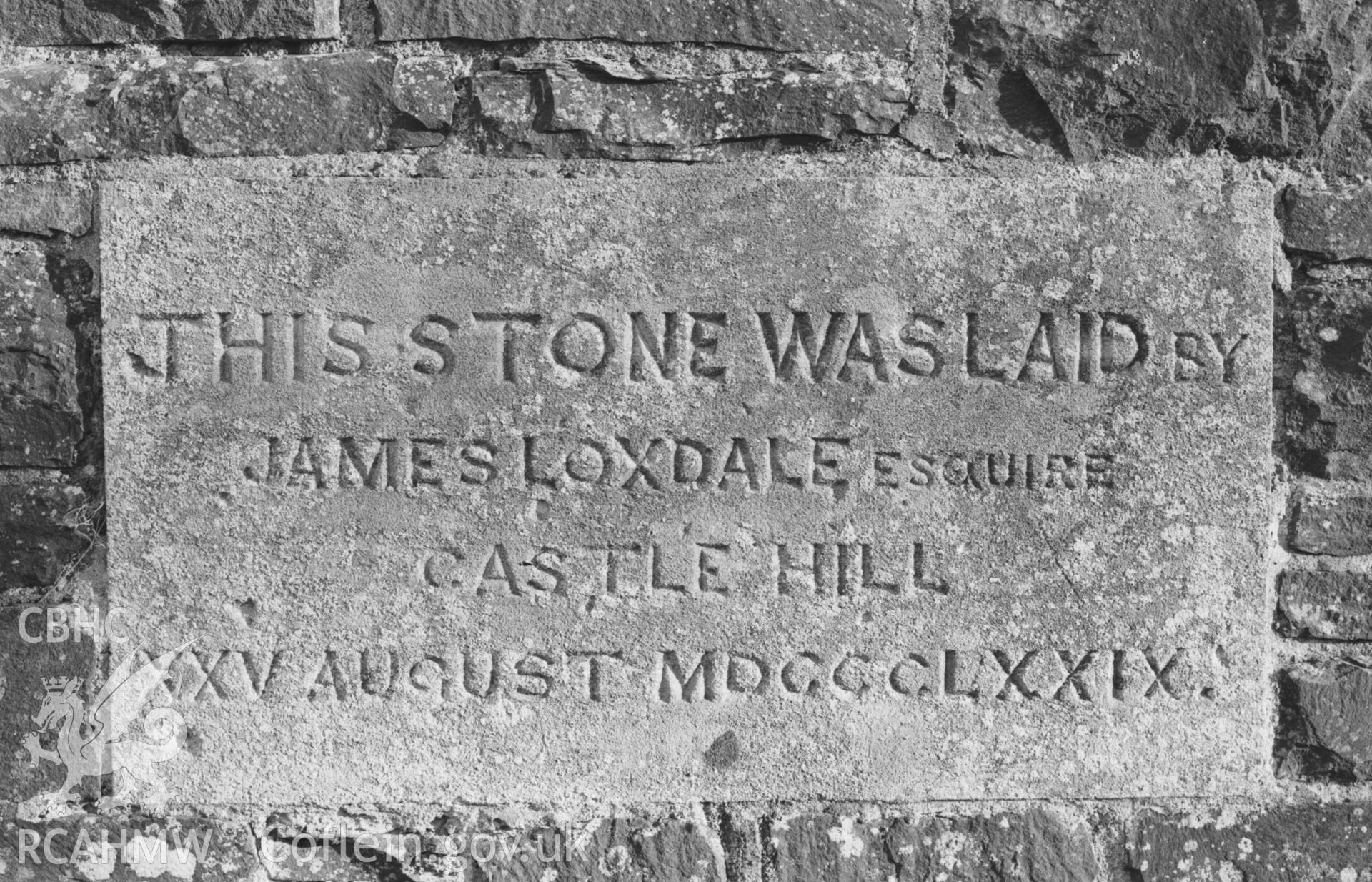 Digital copy of a black and white negative showing stone set near base of east wall on outside of St Ursula's church, Llangwyryfon. Photographed by Arthur Chater on 30 December 1968. Looking east from Grid Reference SN 5917 7053.
