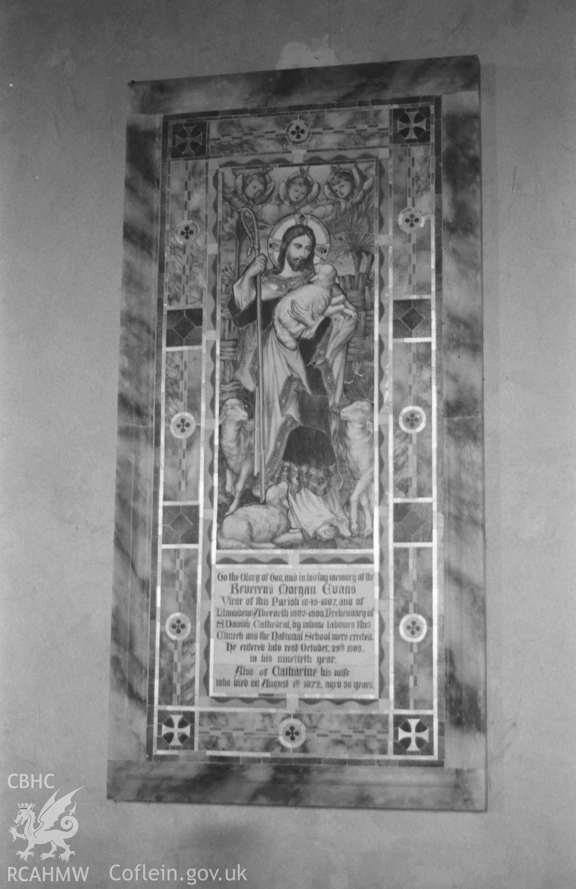 Digital copy of a black and white negative showing ceramic memorial, framed in marble, on the north wall of the nave of St Ursula's church, Llangwyryfon. Photographed by Arthur Chater on 30 December 1968. Looking east from Grid Reference SN 5962 7053.