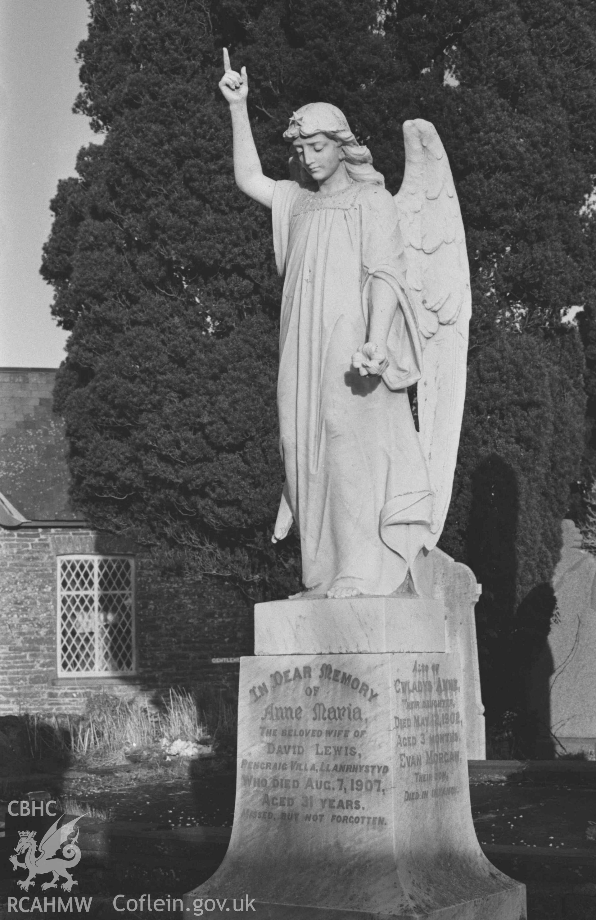Digital copy of a black and white negative showing memorial to Anne Maria Lewis, 1907, in west corner of old graveyard at St Ursula's church, Llangwyryfon. Photographed by Arthur Chater on 30 December 1968. Looking north north east from Grid Reference SN 5966 7052.