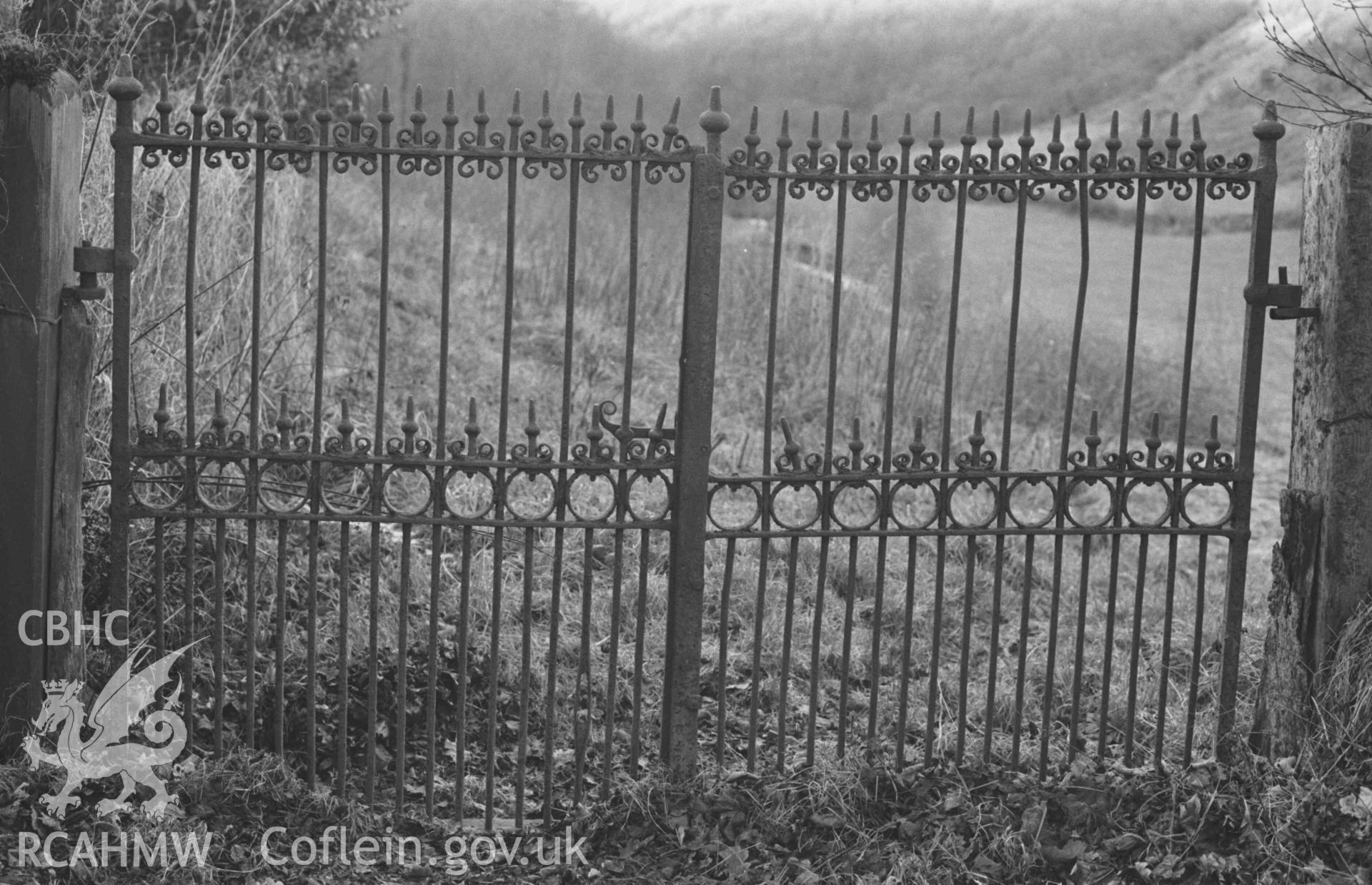 Digital copy of a black and white negative showing iron gates leading into field from lane, immediately north of Capel Tabot, Llangwyryfon. Photographed by Arthur Chater on 30 December 1968. Looking west from Grid Reference SN 5974 7066.