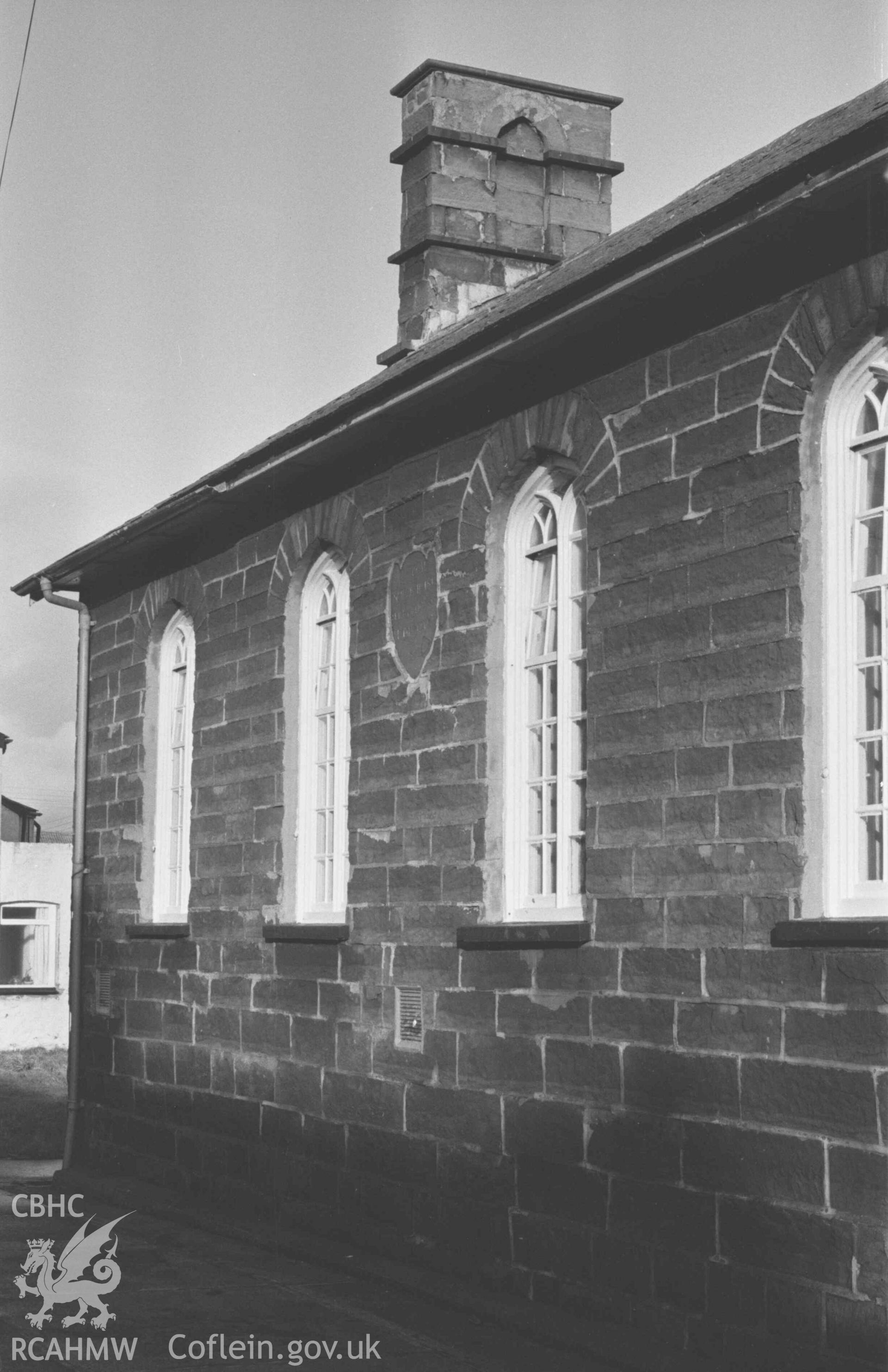Digital copy of a black and white negative showing the west front of the National School House, Borth. Photographed by Arthur Chater on 2 January 1969. Looking north east from Grid Reference SN 6084 8949.