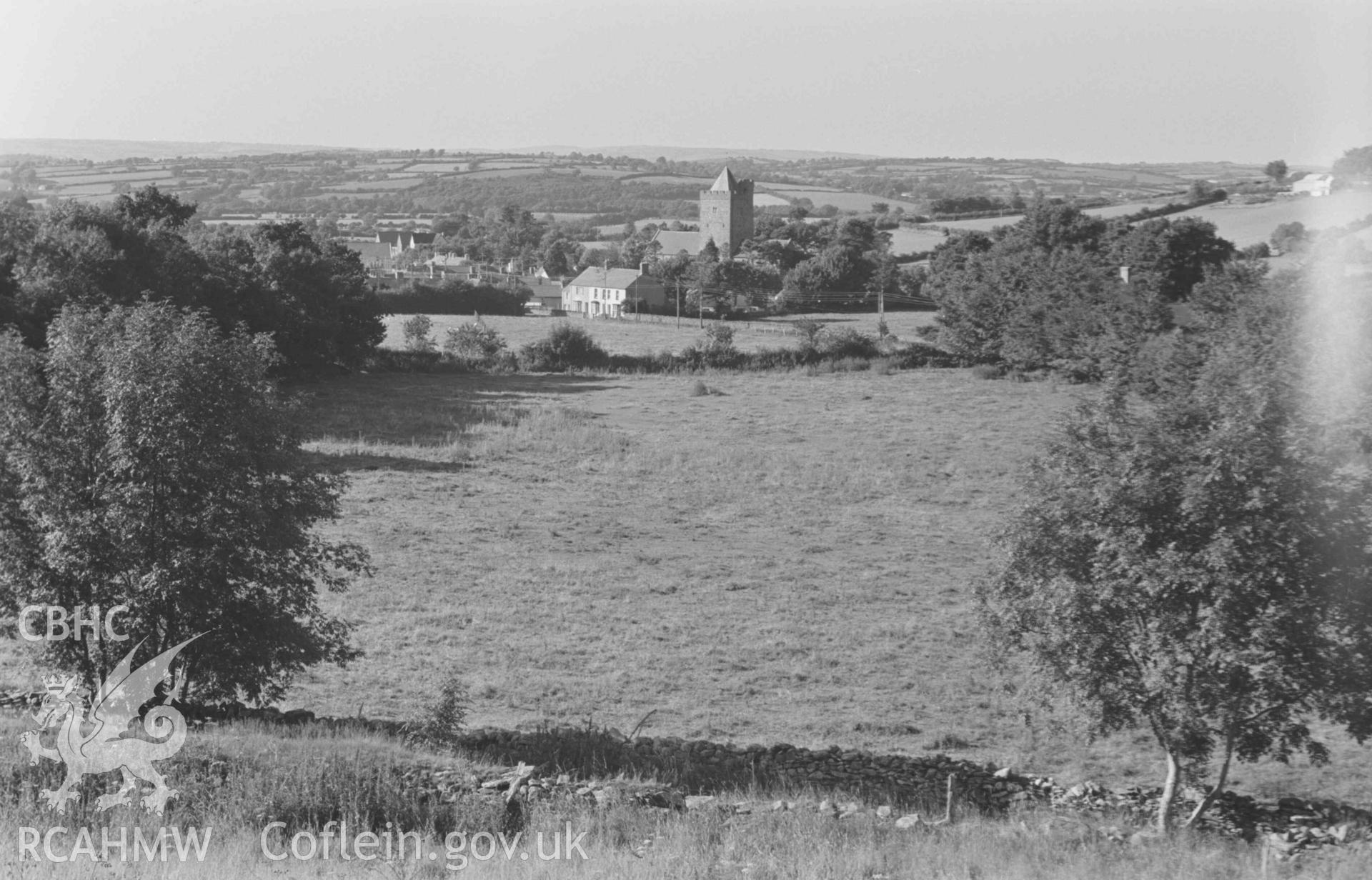 Digital copy of a black and white negative showing the church at Llanddewi-Brefi from Pentre-Rhew. Photographed by Arthur Chater on 22 August 1968. Looking north from Grid Reference SN 665 548.