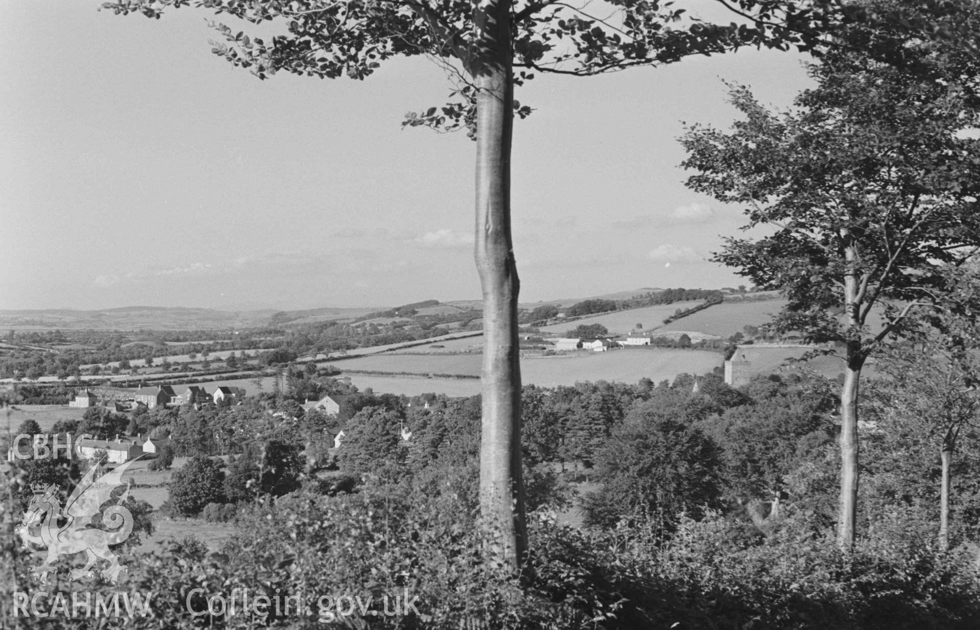 Digital copy of a black and white negative showing Llanddewi-Brefi from the road by the quarry above Troed-y-Rhiw. Photographed by Arthur Chater on 22 August 1968. Looking north north west from Grid Reference SN 660 548.