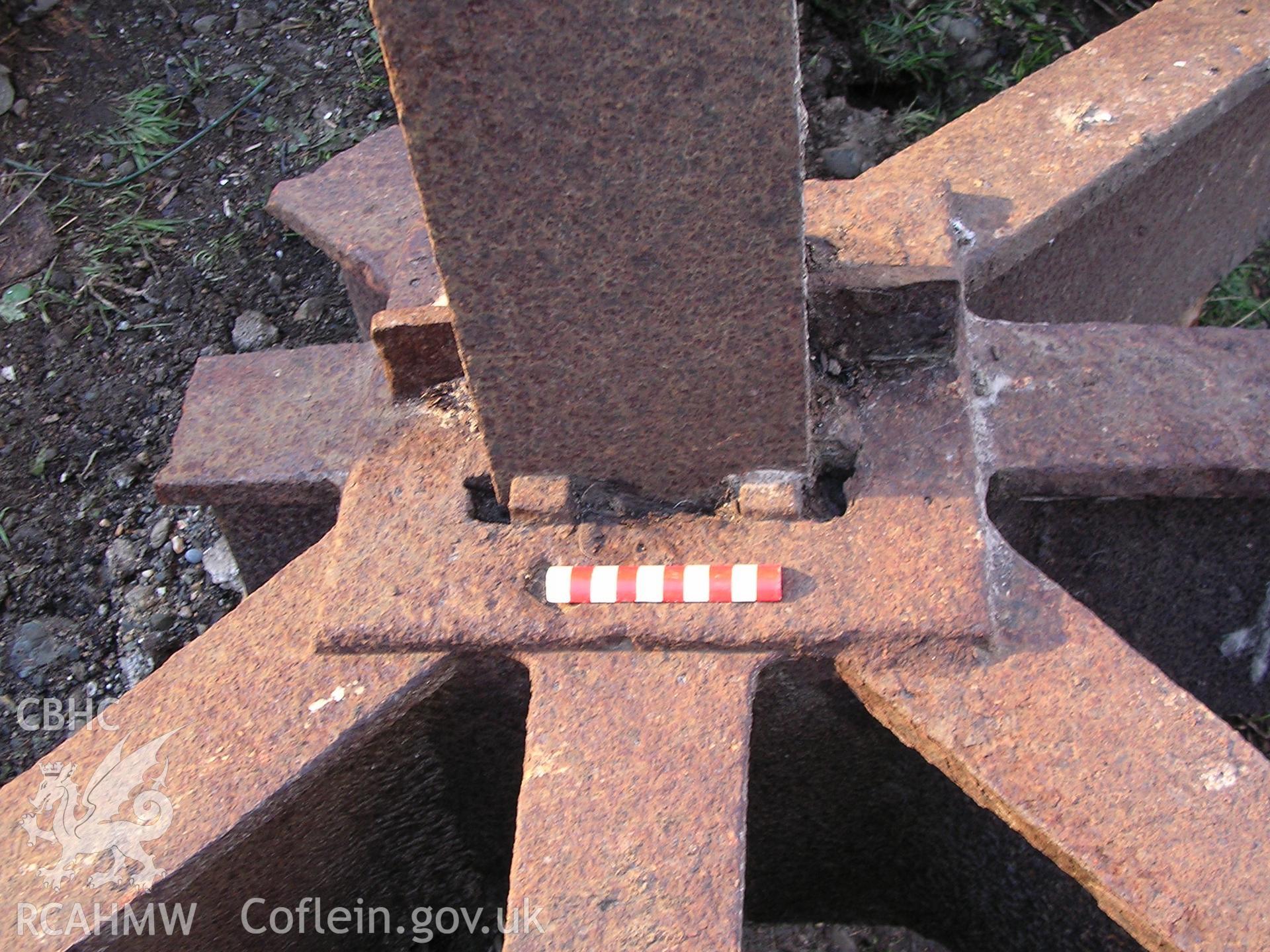 Digital photograph showing part of a disused mill cogwheel.