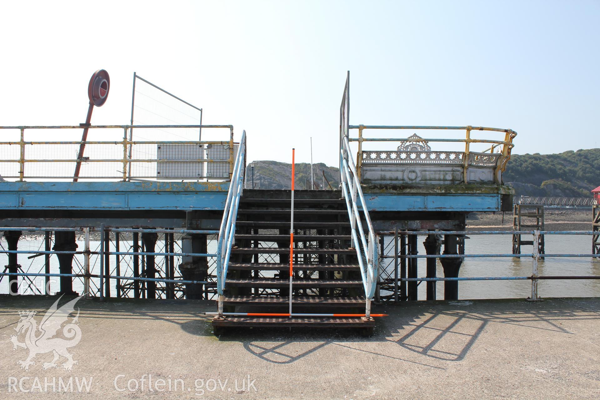 Steps from end of pier to concrete landing stage.