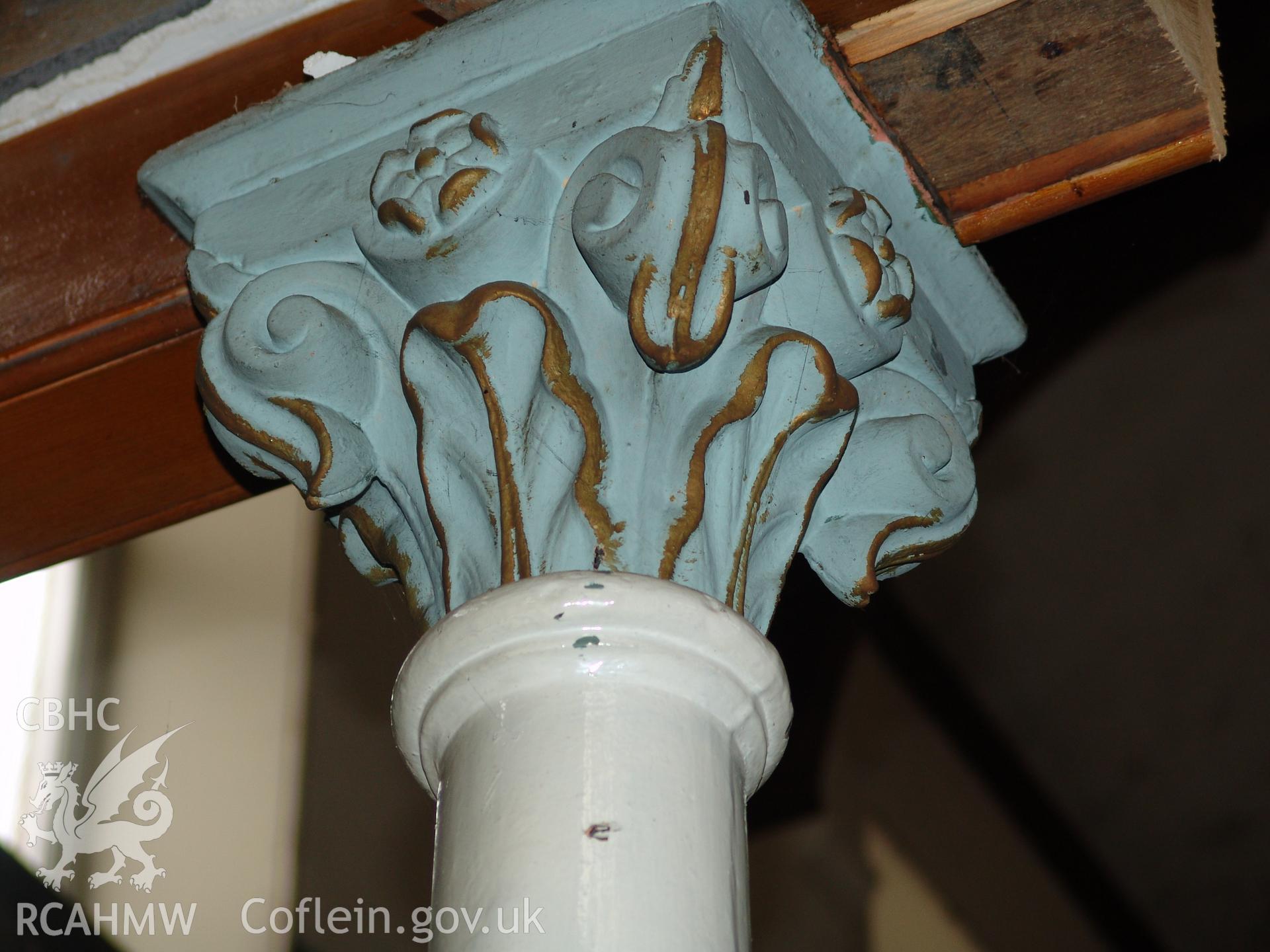 Photograph from a building recording survey: Zion Chapel, High Street, Newbridge, Gwent; detail of cast iron column supporting balcony. Carried out by A. P. A. C. Ltd. in September 2008.