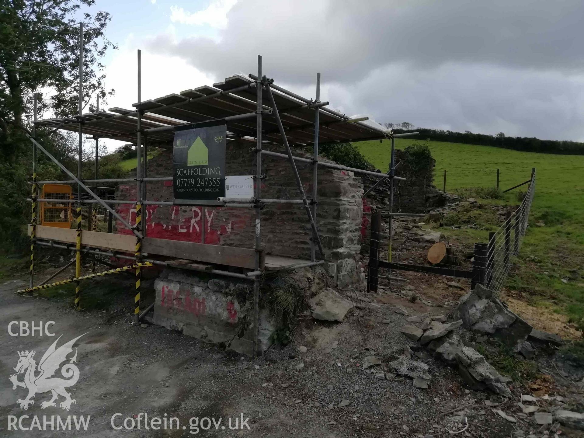 Digital colour photograph showing Cofiwch Dryweryn Wall, during stonemason repairs. Taken 25 September 2020.