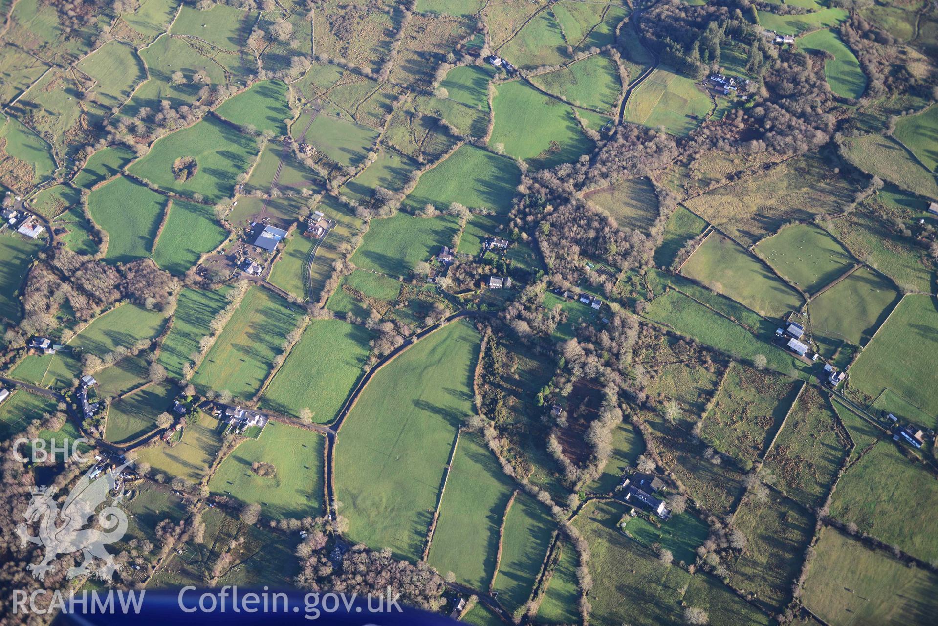 Oblique aerial photograph of the landscape near Tryfan Hall, with Tryfan Mawr and Tryfan Bach, taken from the south east during the Royal Commission’s programme of archaeological aerial reconnaissance by Toby Driver on 12th January 2022